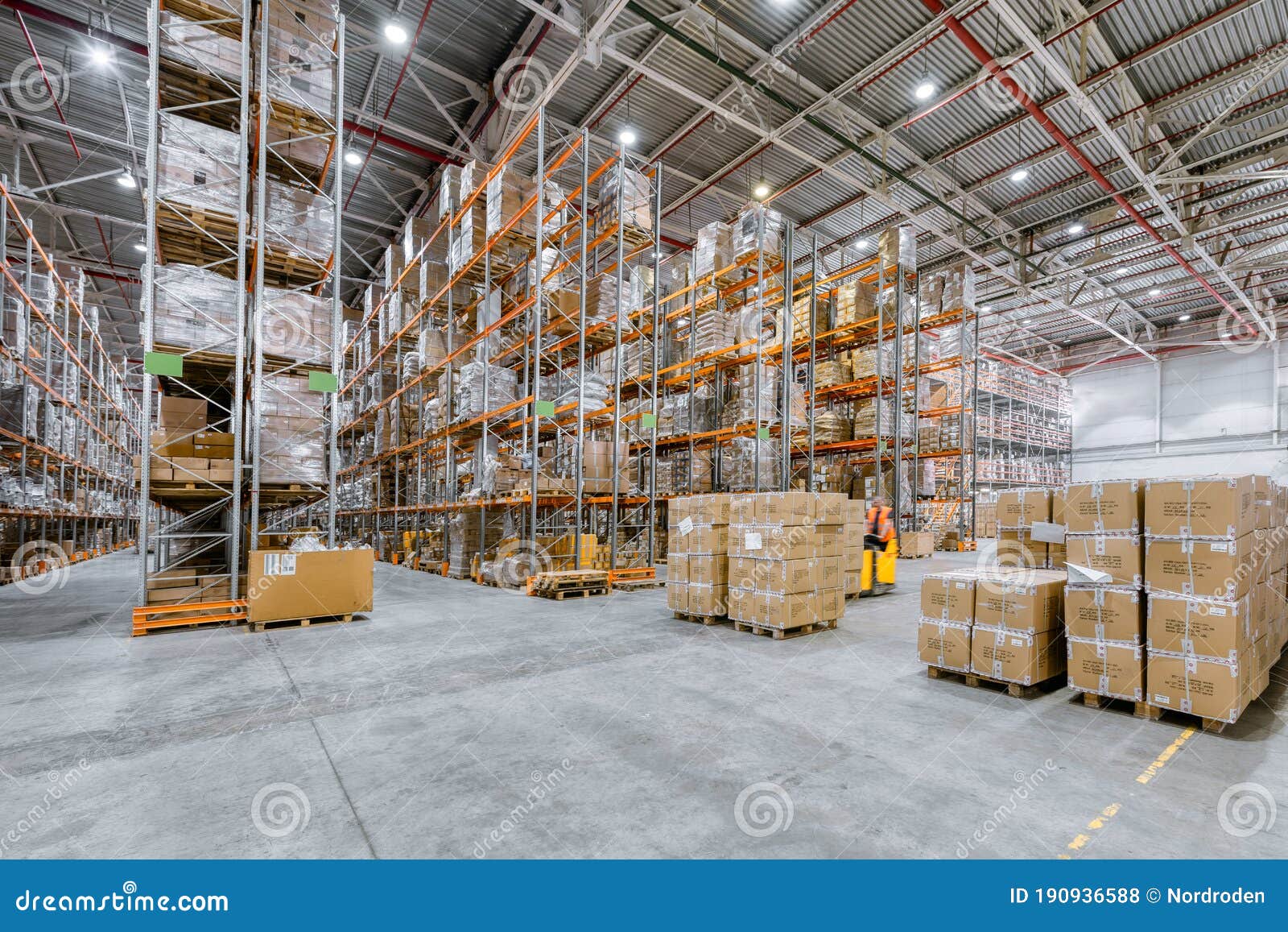 Large Industrial Warehouse. Many Cardboard Boxes Stand on a Loading