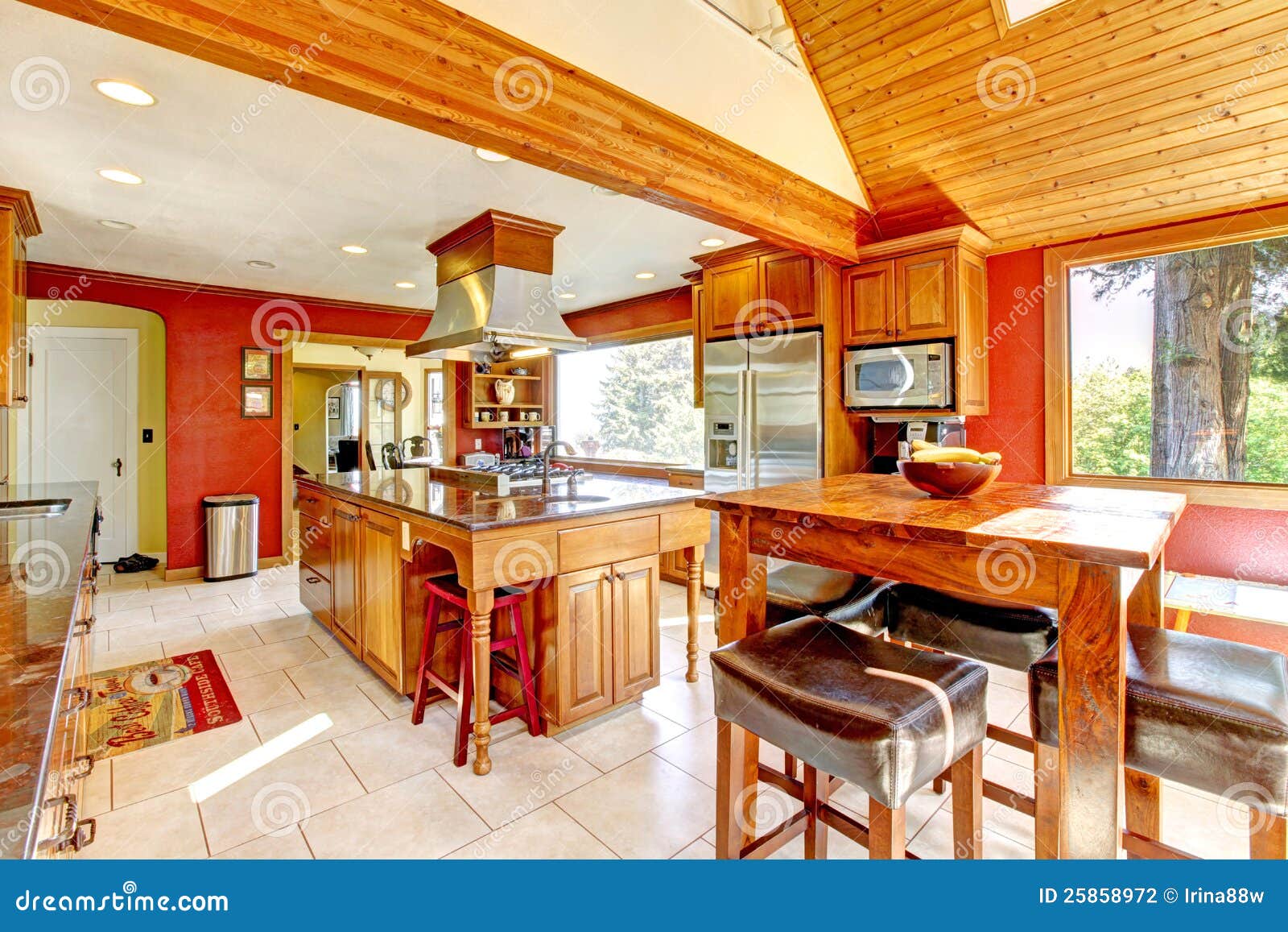 Large Kitchen with Red Walls and Wood Ceiling. Stock Photo Image of