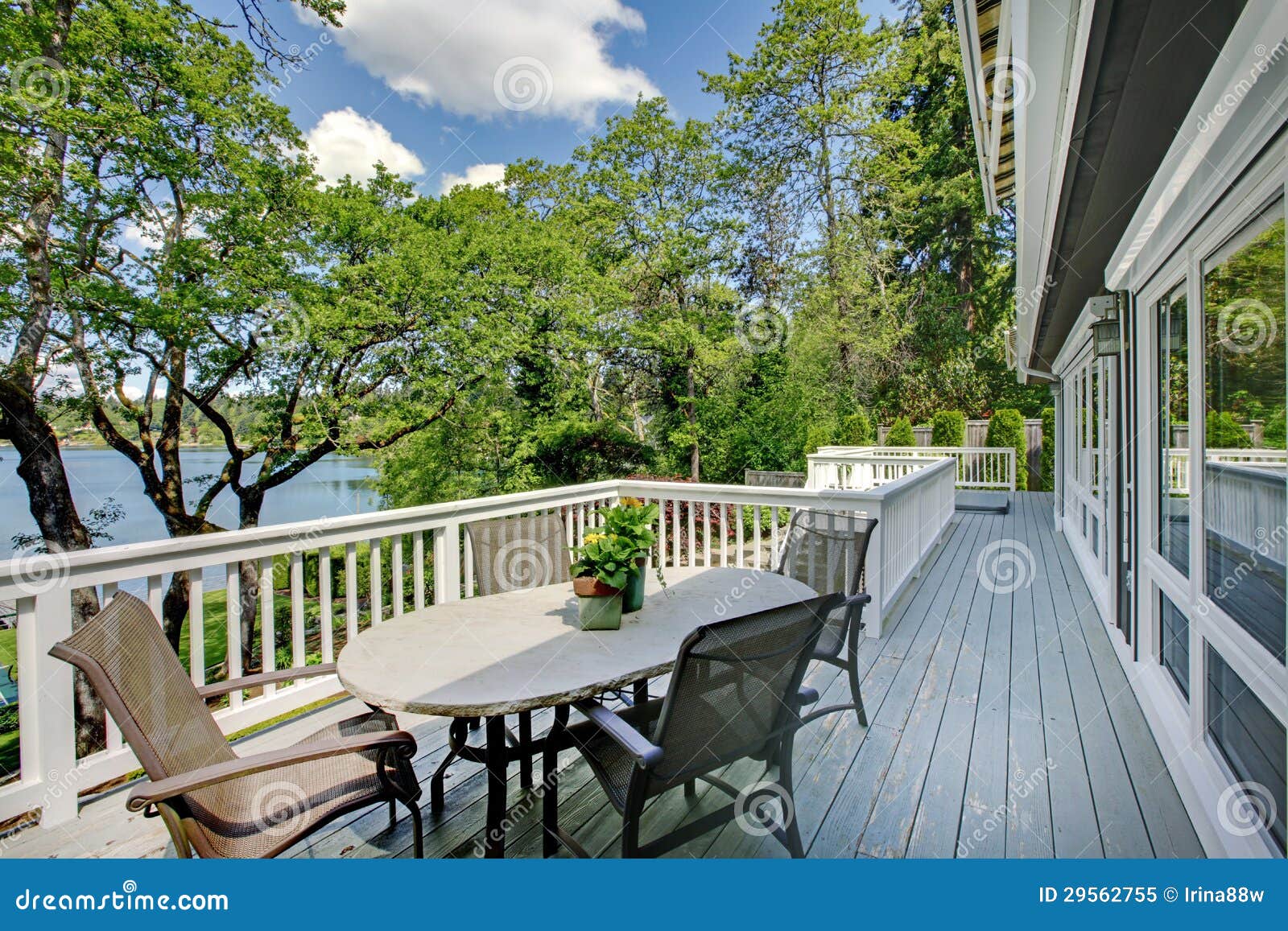 Large Long Balcony Home Exterior with Table and Chairs, Lake View