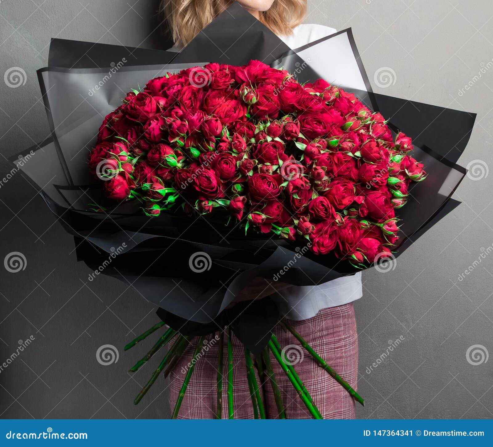 A Large Lush Bouquet of Red Garden Roses and Buds in Black Wrapping Paper,  a Stylish Stock Image - Image of background, design: 147364341