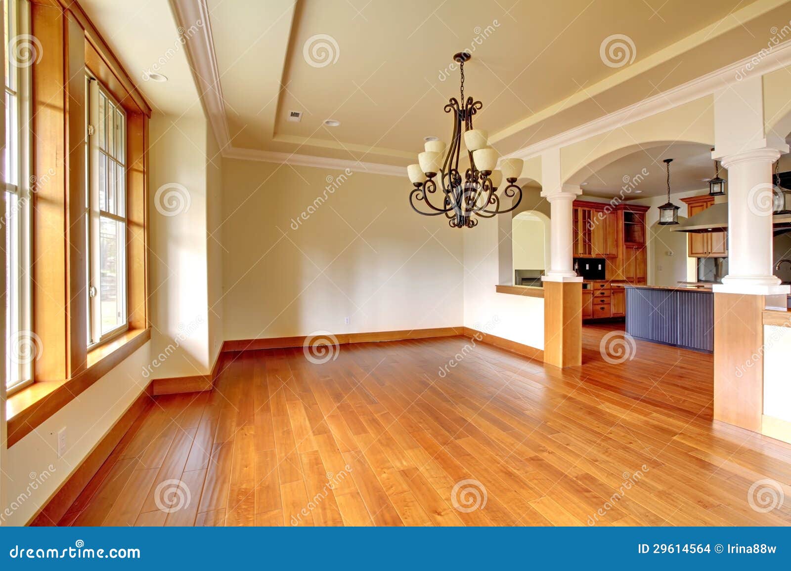 Large Luxury Dining Room Interior with Kitchen and Arch. Stock Photo