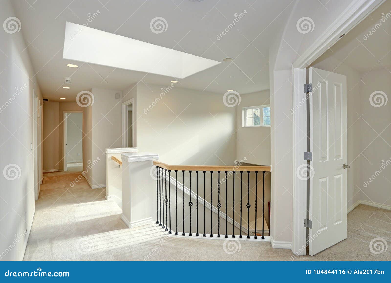 second floor landing with skylight and staircase