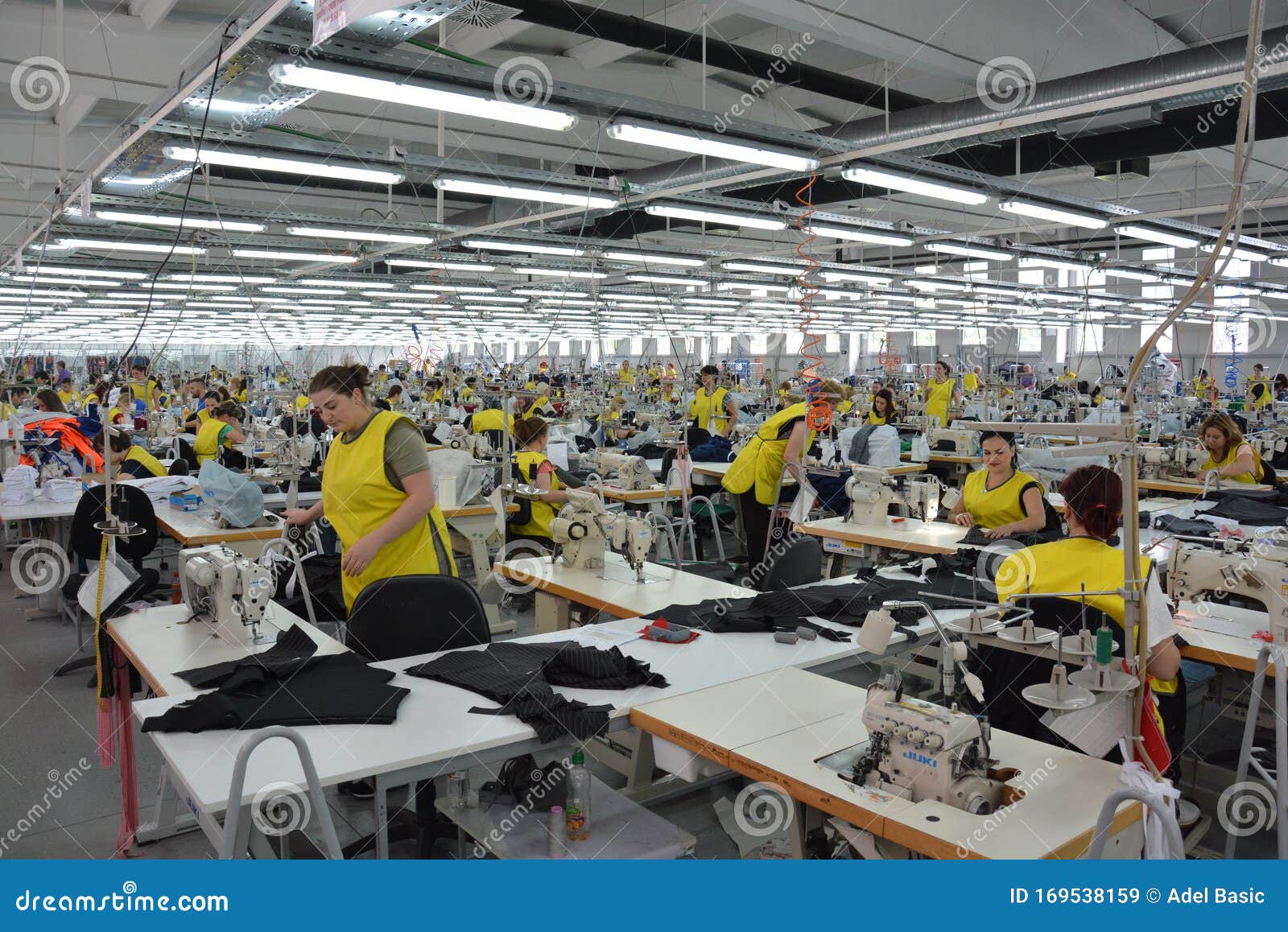 Production Hall with Workers in a Textile Industrial Company Editorial