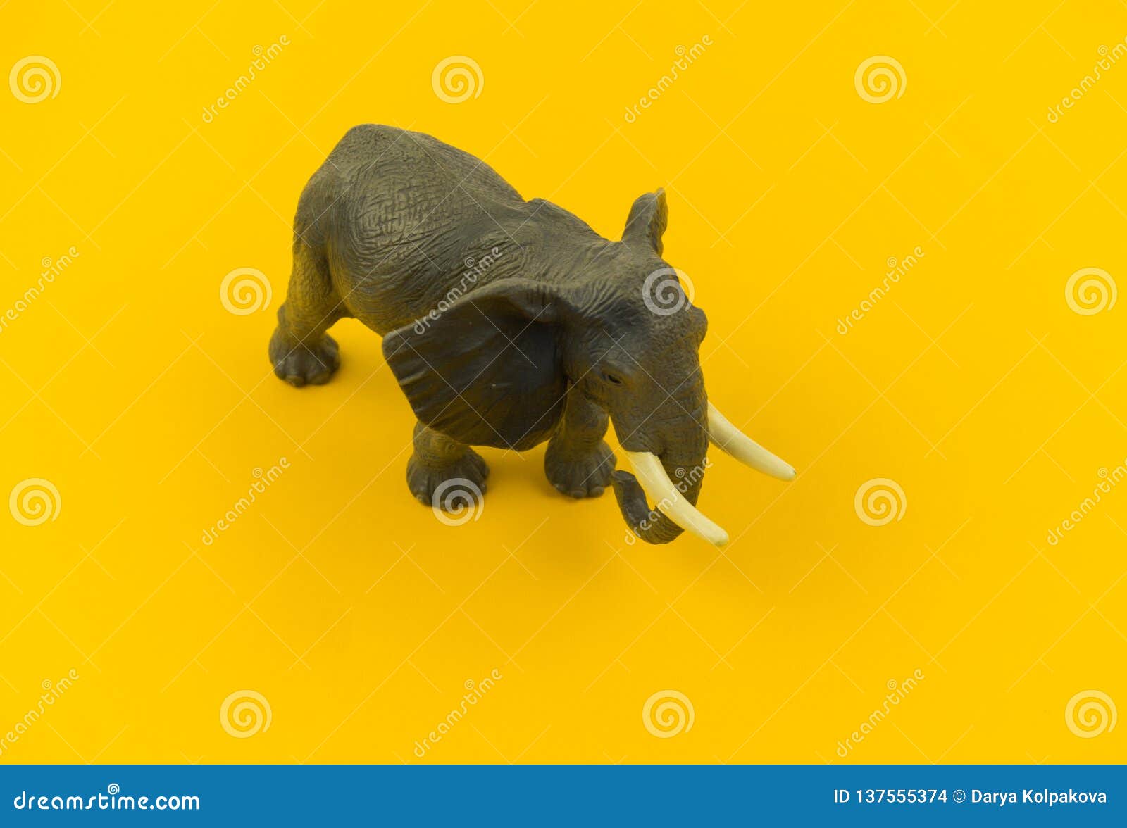 Large Plastic Elephant Toy on a Yellow Background Stock Photo - Image of  figure, elephant: 137555374