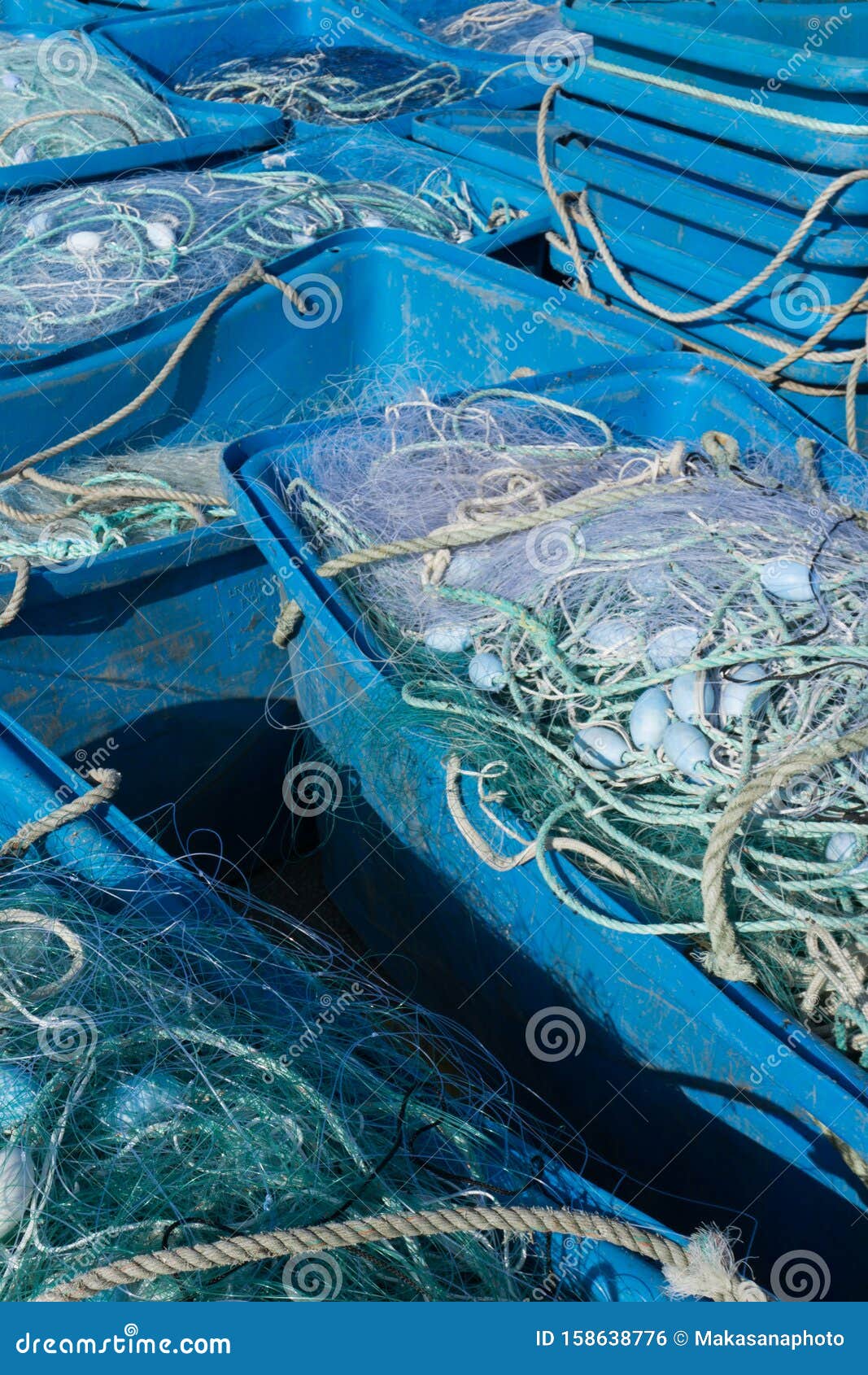 https://thumbs.dreamstime.com/z/large-plastic-tubs-filled-industrial-size-fishing-trawling-nets-used-offshore-fishing-industry-detail-view-158638776.jpg