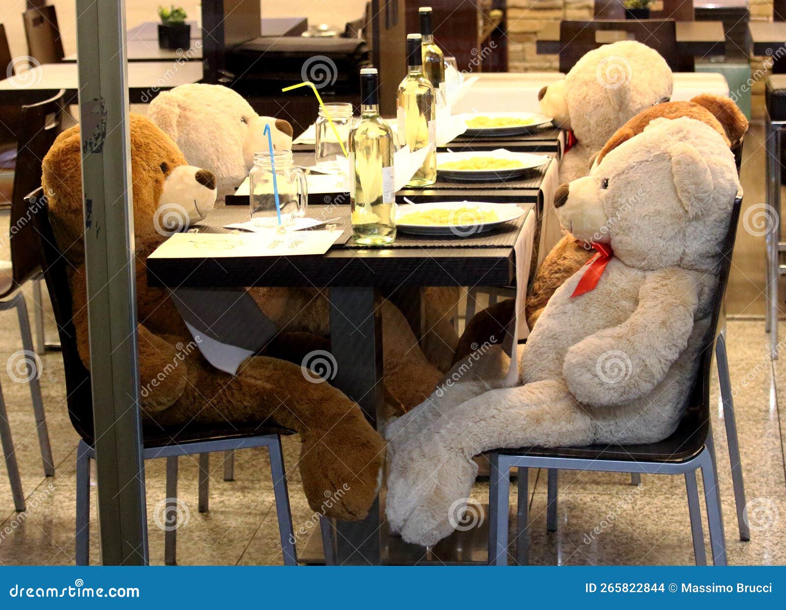 Large Puppets at a Table in a Restaurant for Lunch Stock Photo Image