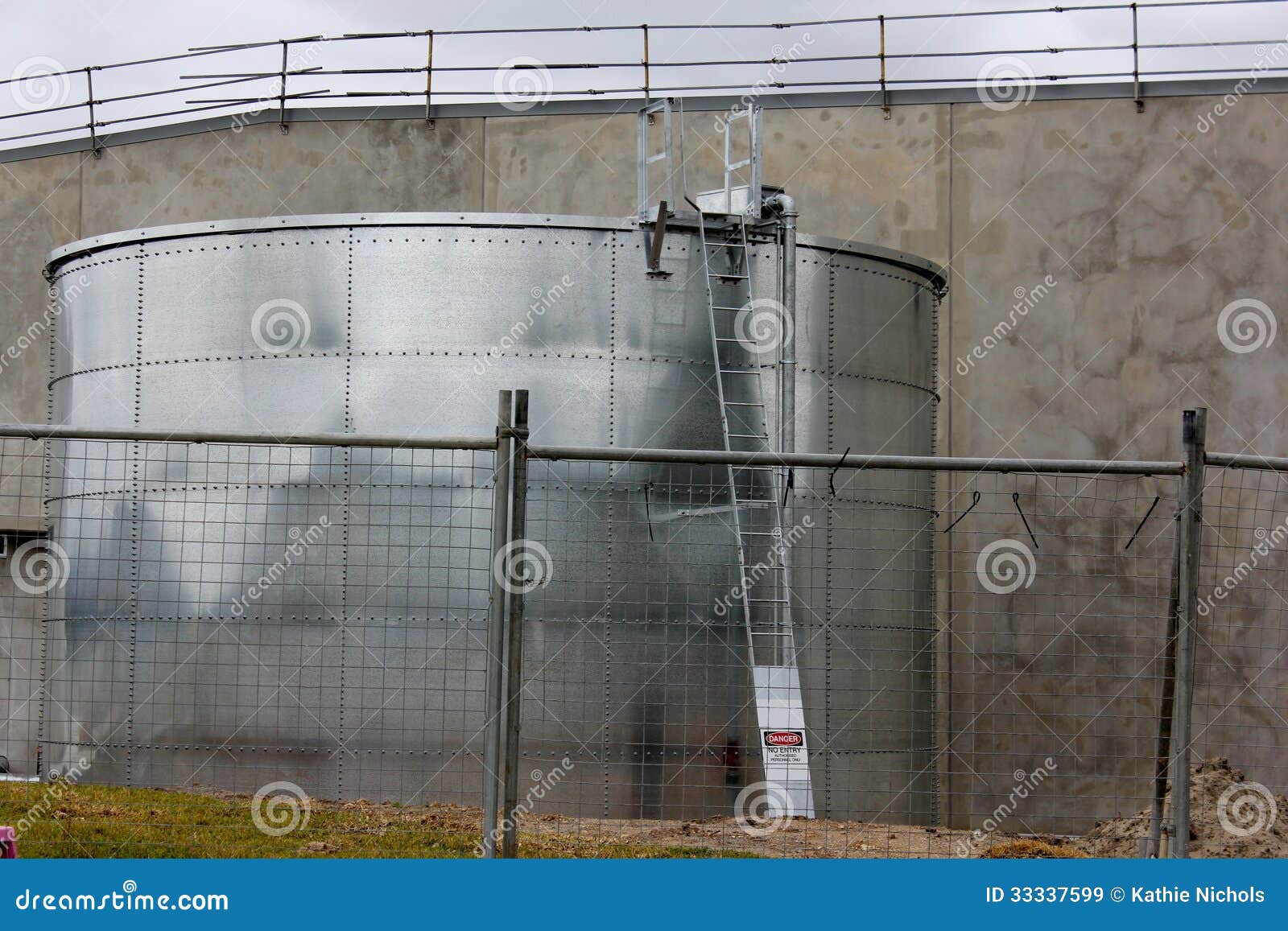 A large rainwater tank recently installed in an industrial area for a new building.