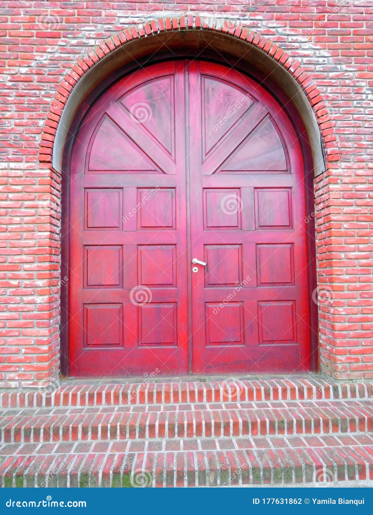 large red doorway with red brick wall or steps