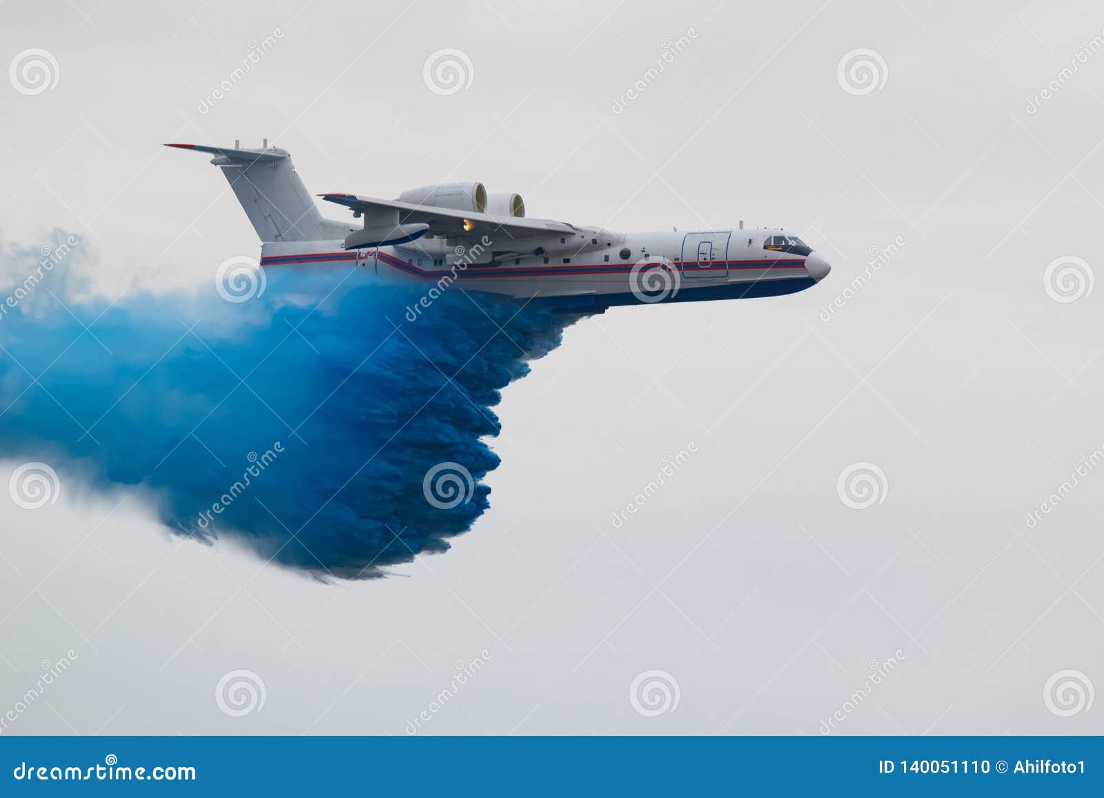 a large rescue plane dumps water to extinguish a fire