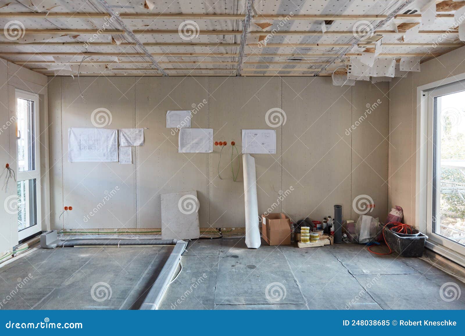 Large Room in Drywall House Construction with Blueprint Stock Image