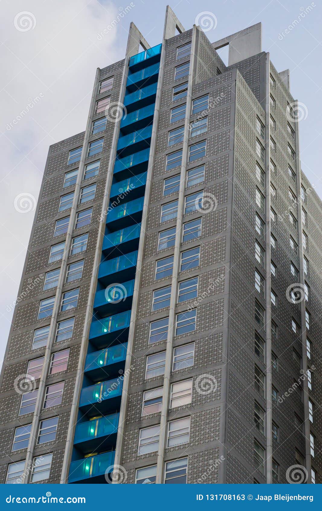 large skyscraper full of apartments with balcony`s exterior architecture background