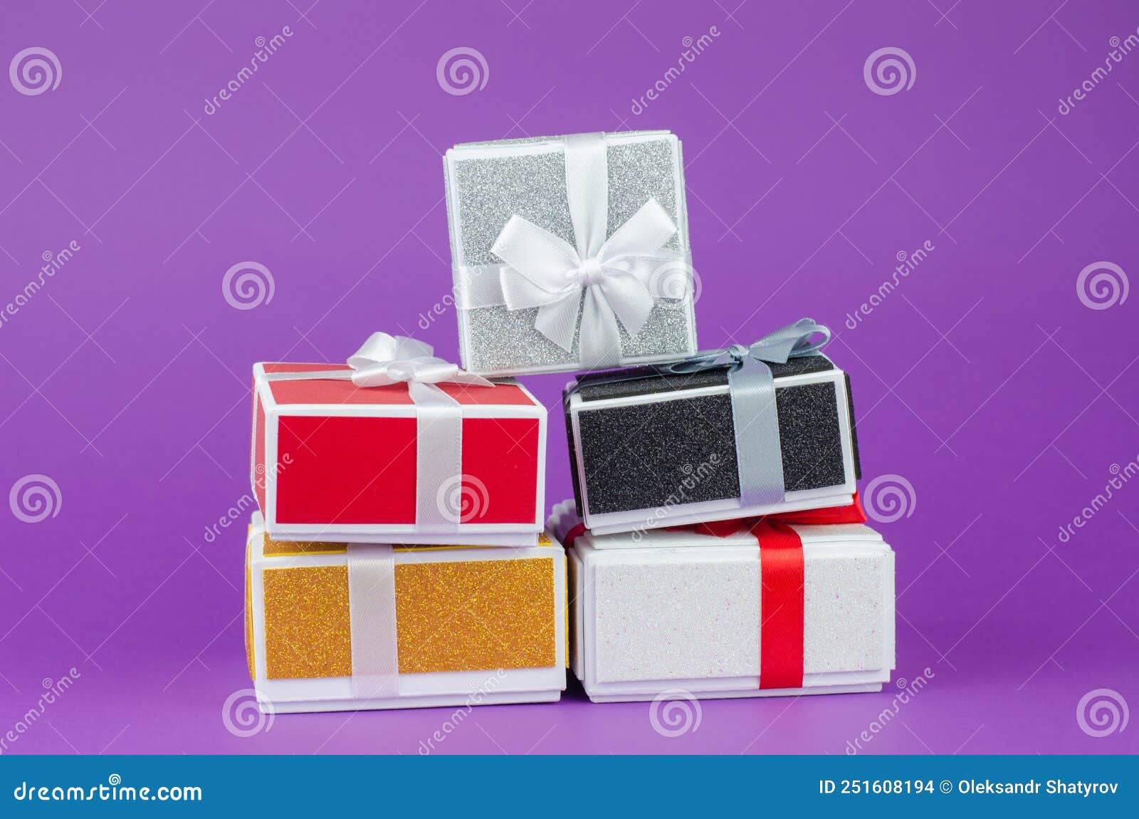 Large and Small Gift Boxes on a Purple Background Stock Photo Image
