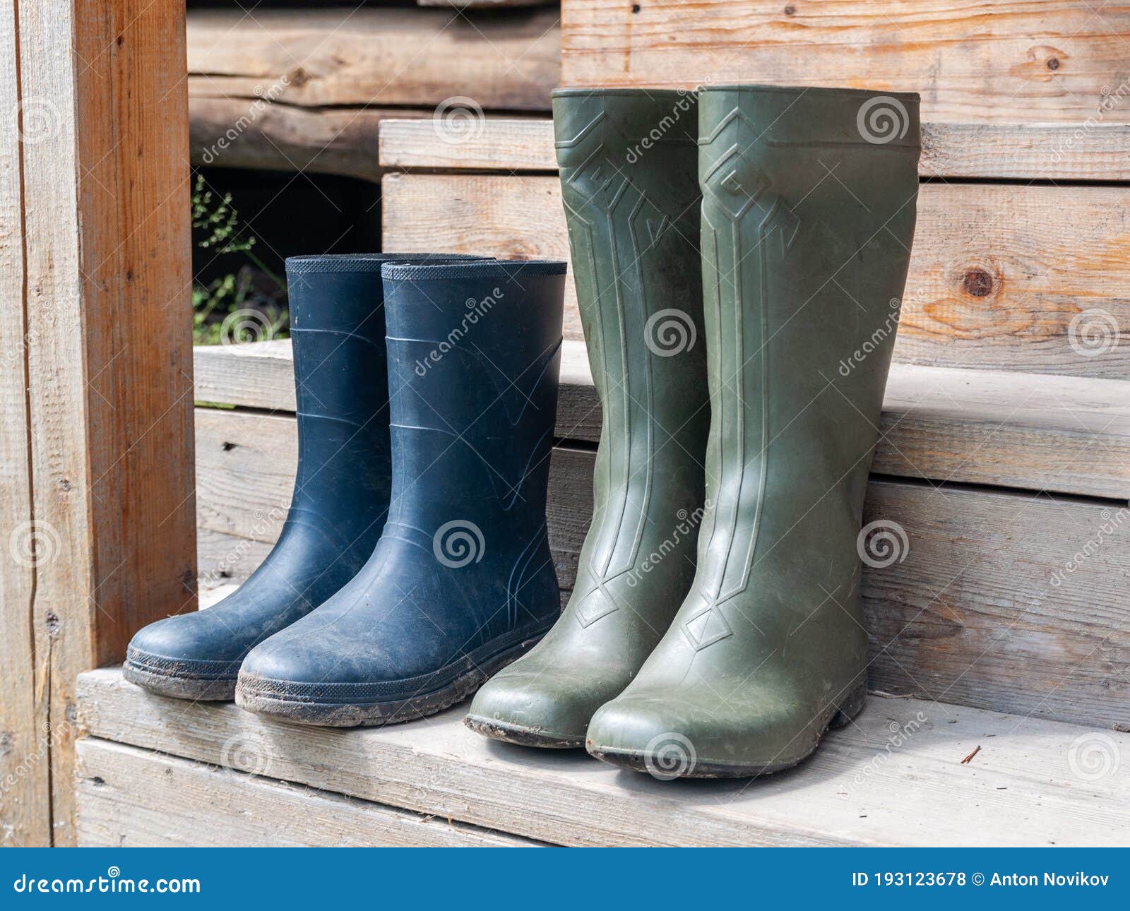 Rubber Boots Standing on the Wooden Steps of the Village House Stock ...