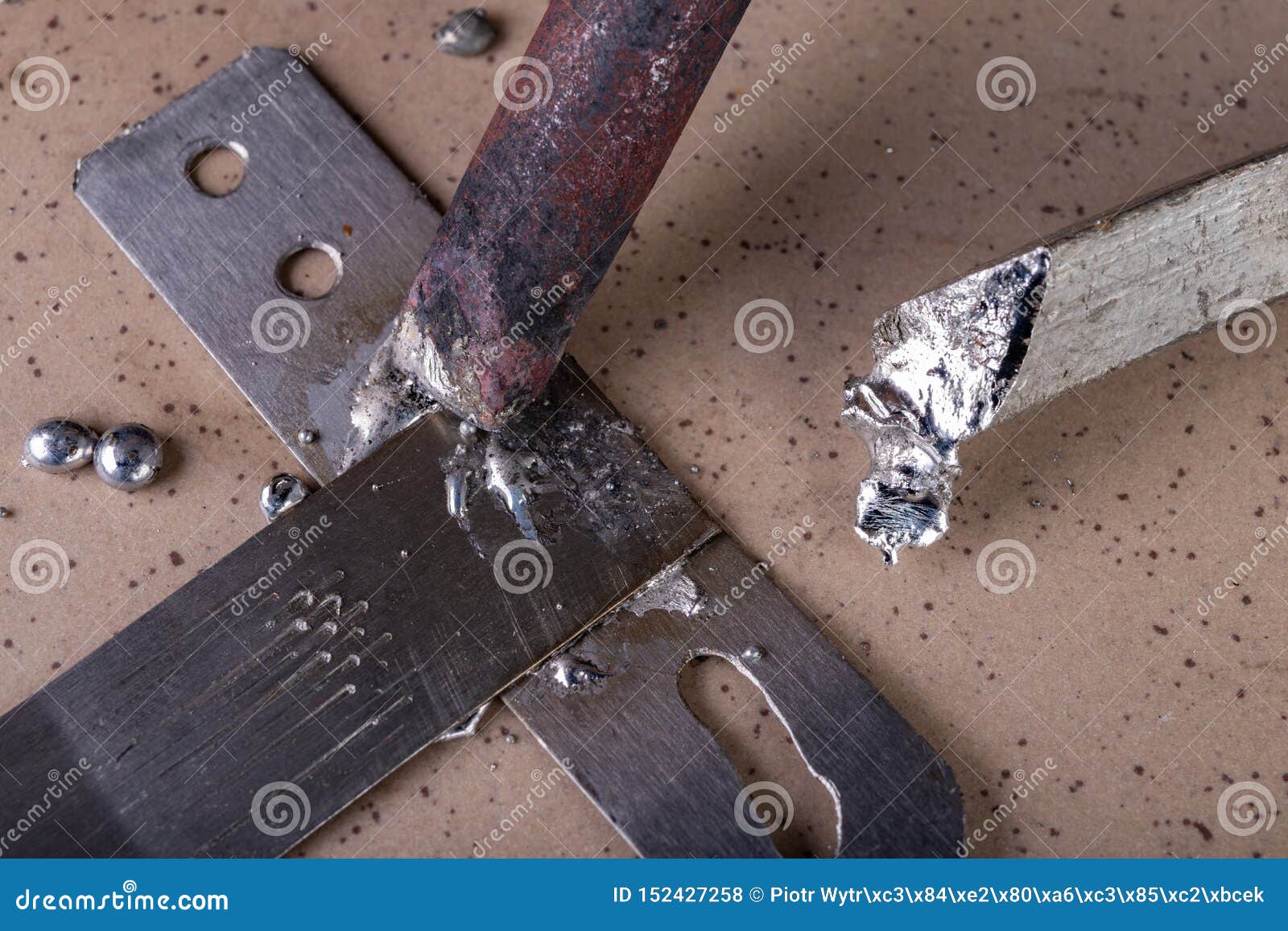 A Large Soldering Iron and Soldering Accessories on a Table