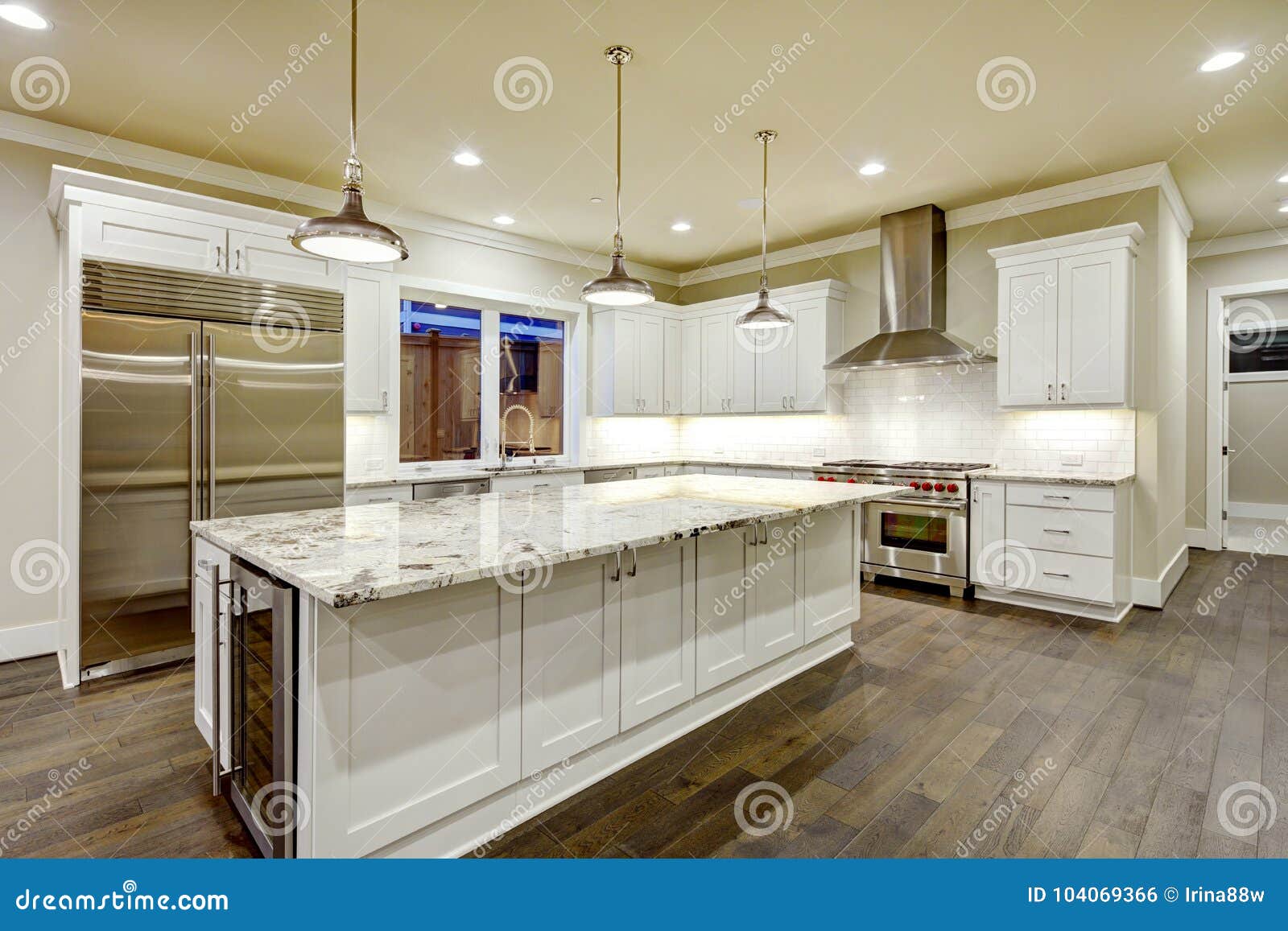 Large Spacious Kitchen Design With White Kitchen Cabinets Stock