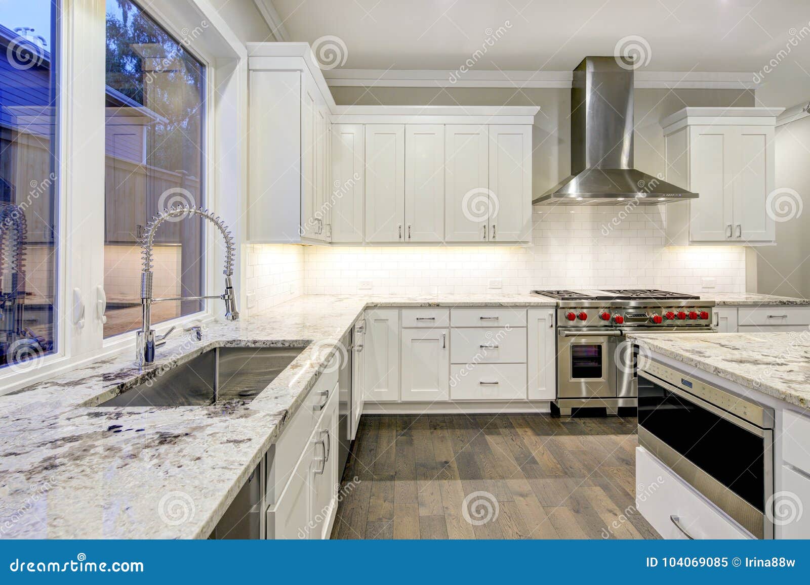 Large Spacious Kitchen Design With White Kitchen Cabinets Stock