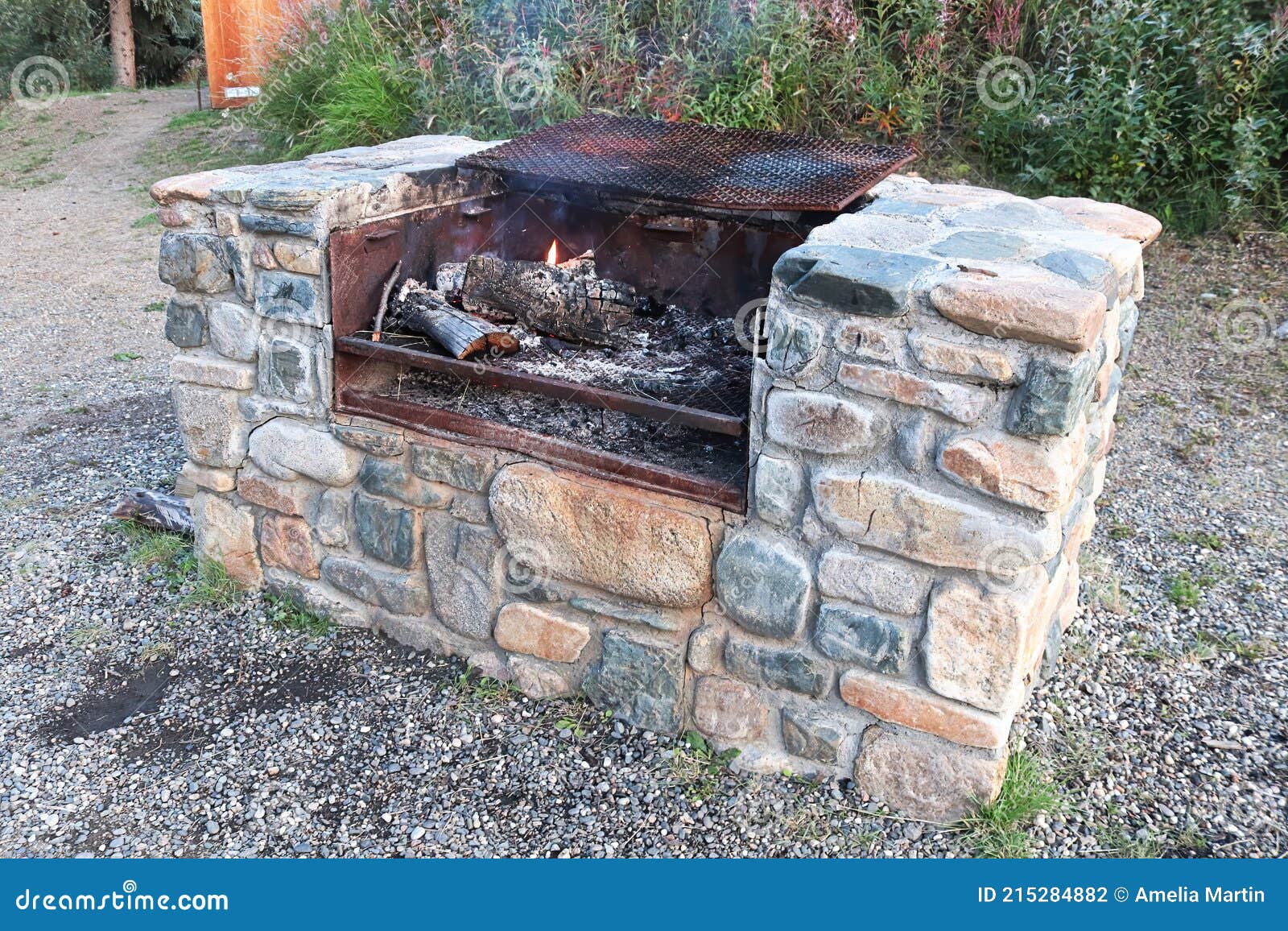 A Large Stone Outdoor Grill with a Fire Burning Stock Photo Image of