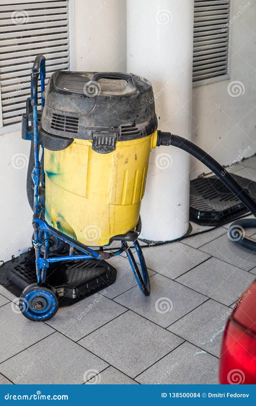 Large Technical Vacuum Cleaner Yellow at the Car Wash Stock Photo
