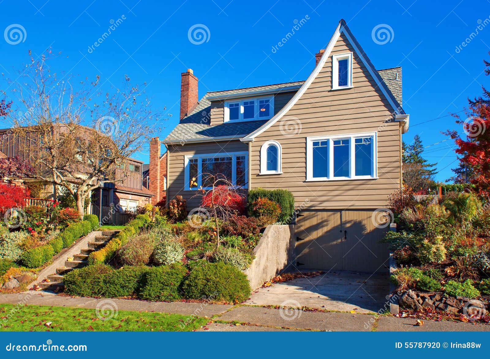 Large Traditional House with Shrubbery. Stock Photo Image of building