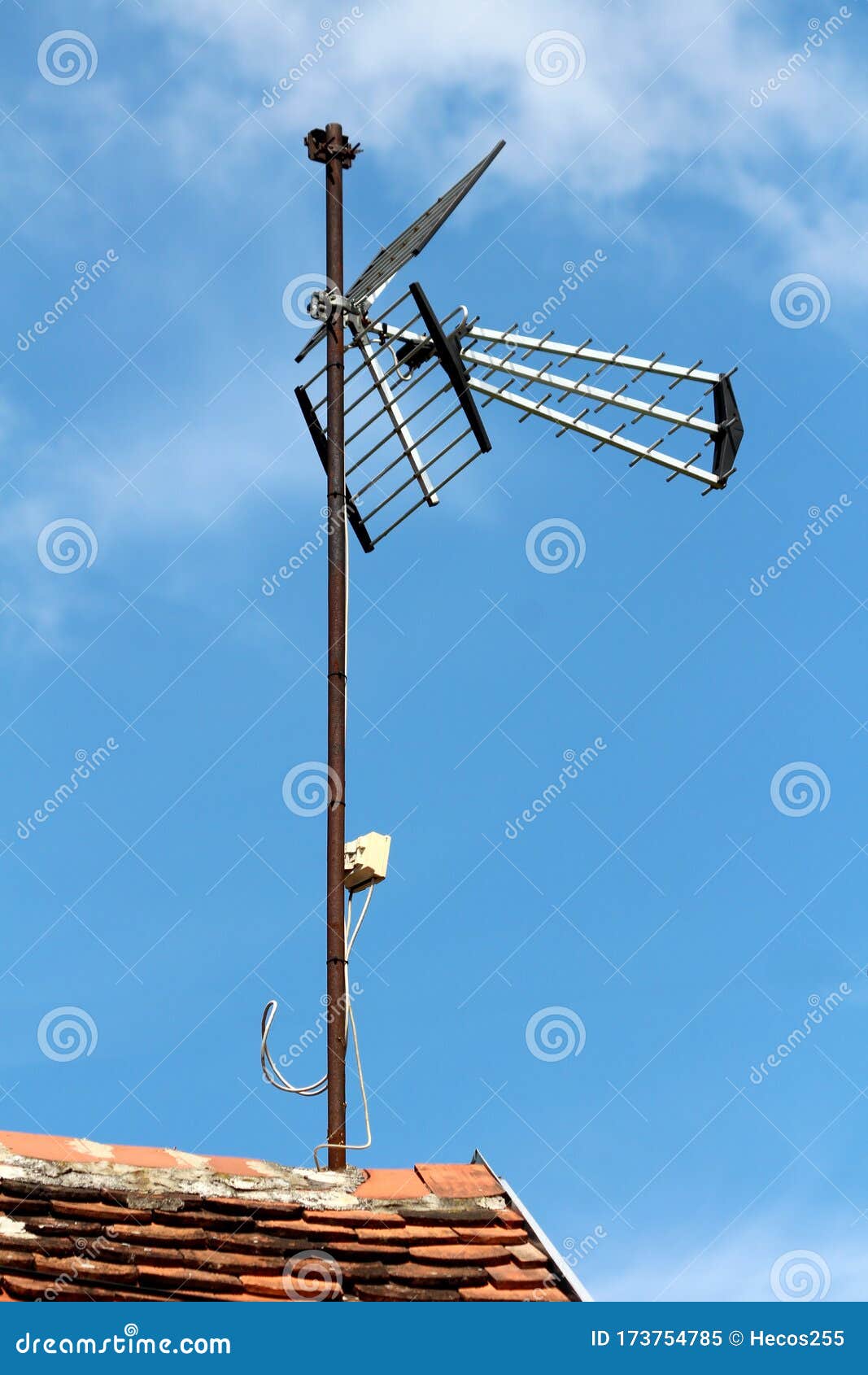 Large Tv Antenna Mounted On Top Of Rusted Metal Pole On Edge Of Family House Roof Covered With Dilapidated Old Roof Tiles Stock Image Image Of Dilapidated Metal