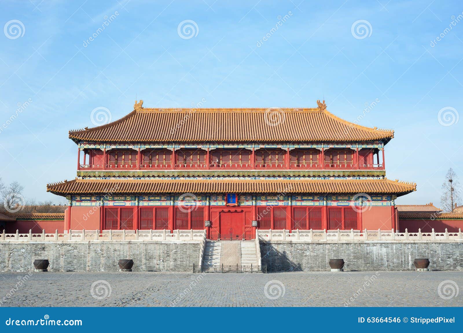 large water cauldrons outside the tower of enhanced righteousness in the main courtyard of the forbidden city, beijing.