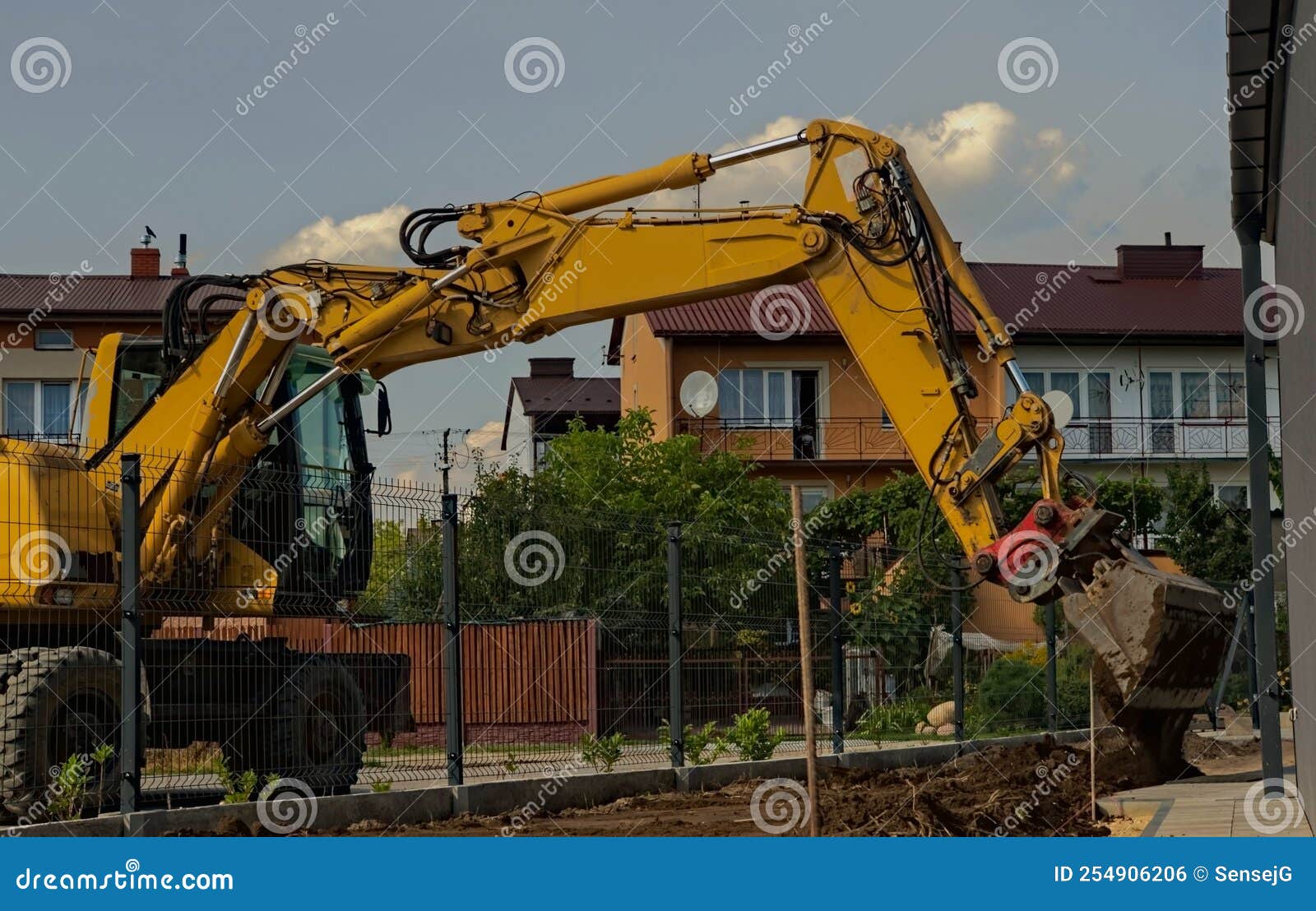 a large excavator on wheels, during horticultural works ...