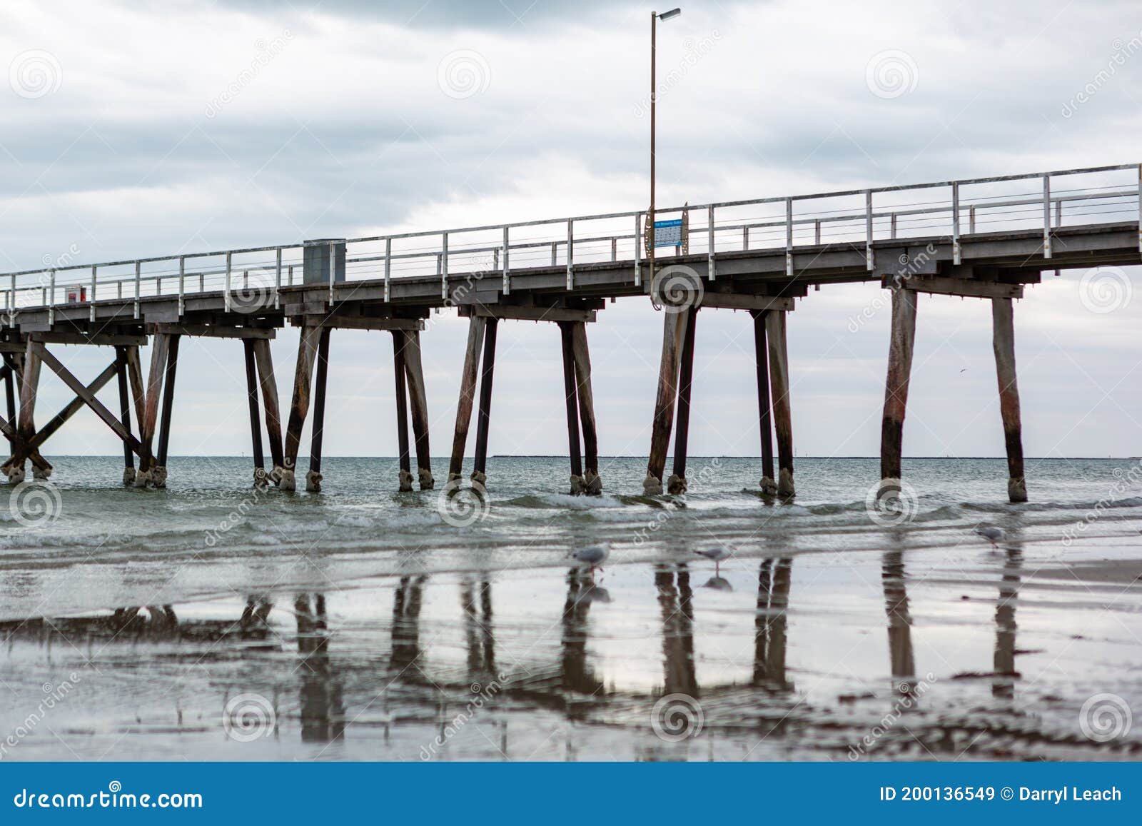The Largs Bay Jetty with Its Reflection in the Foreground in Adelaide South Australia on October