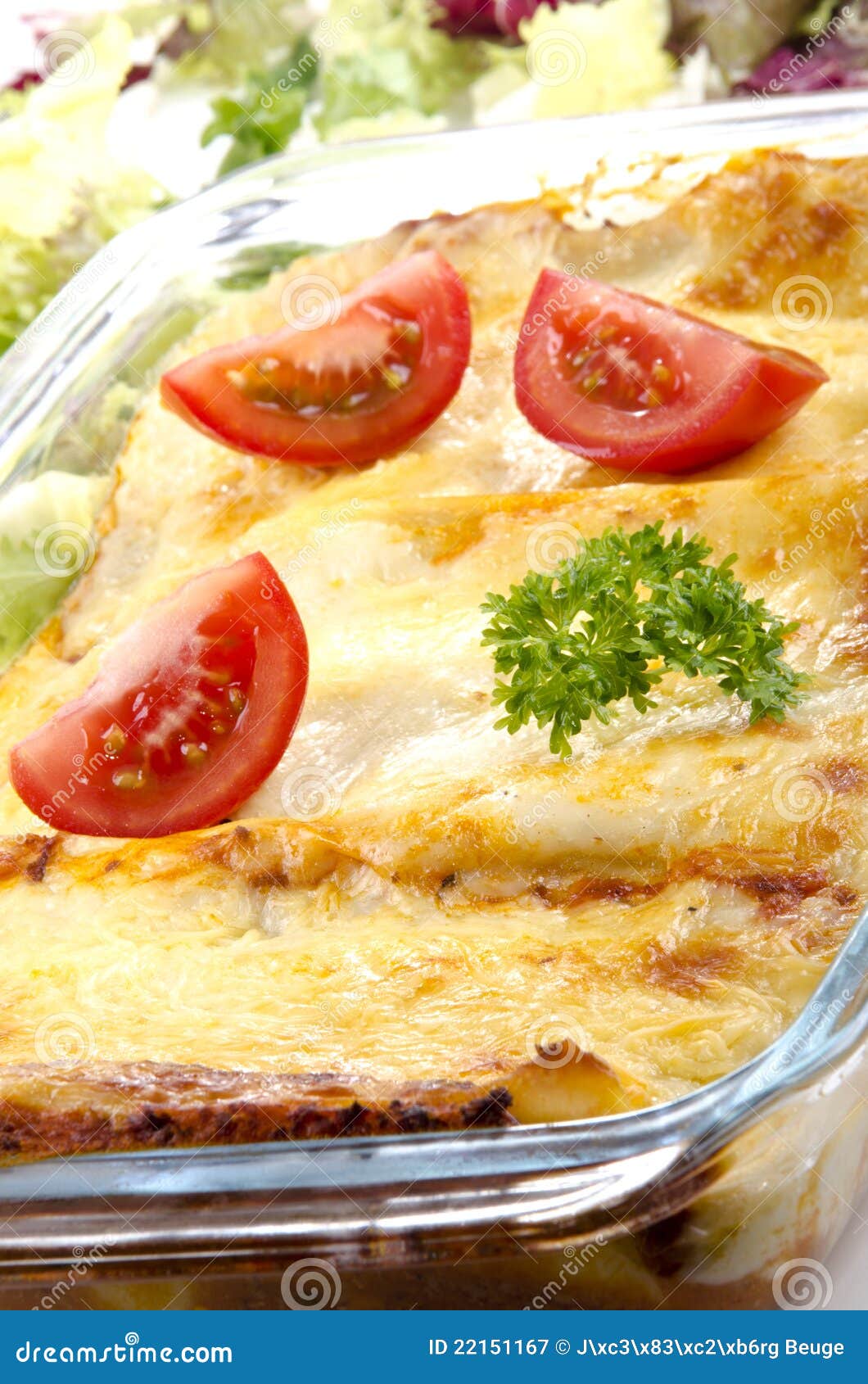 Lasagna in a glass bowl stock image. Image of melted 22151167