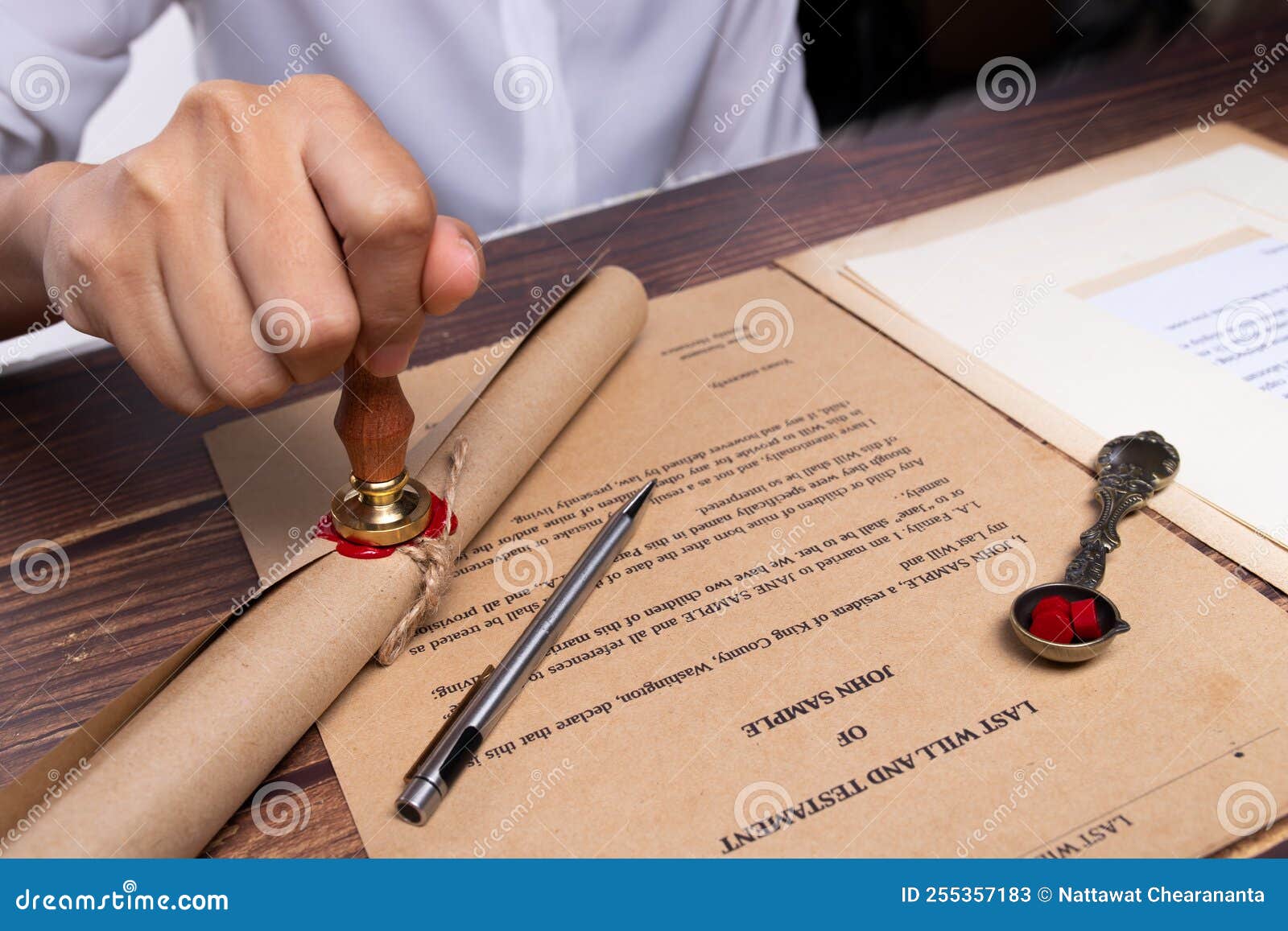 lastwill inheritance document contract is approved by lawyer to seal wax and stamp approval to finance and separate asset by