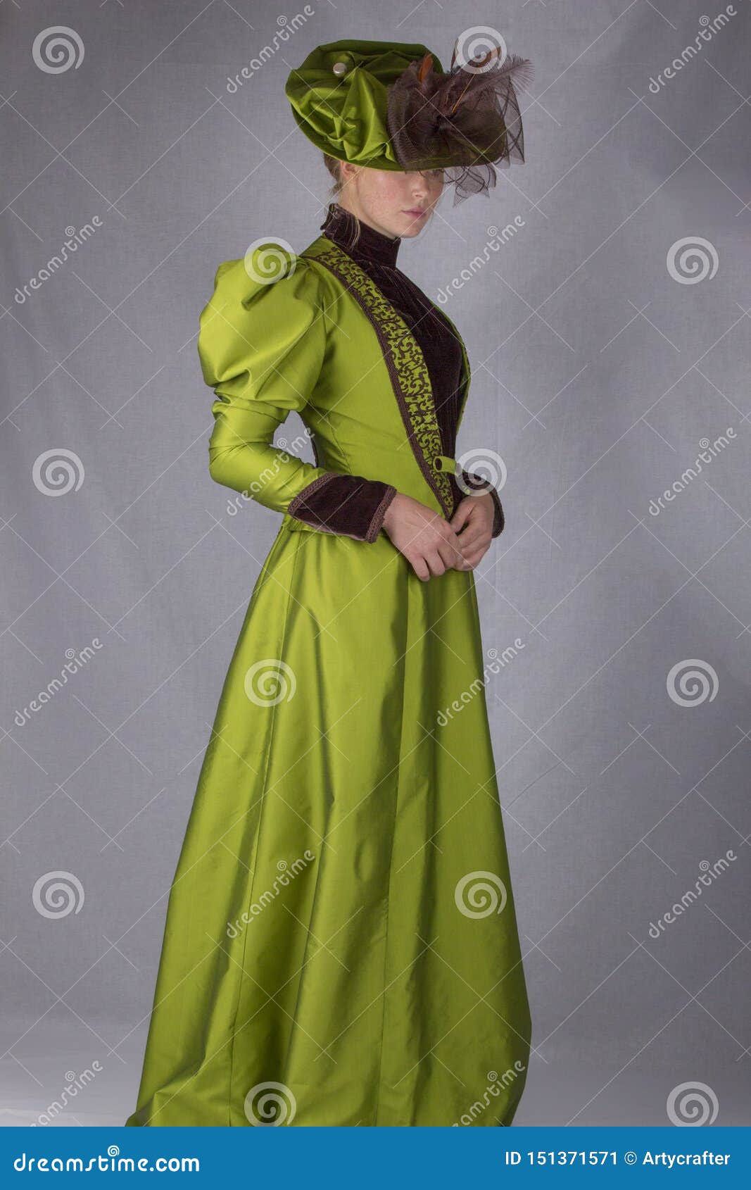 late victorian woman in green silk ensemble