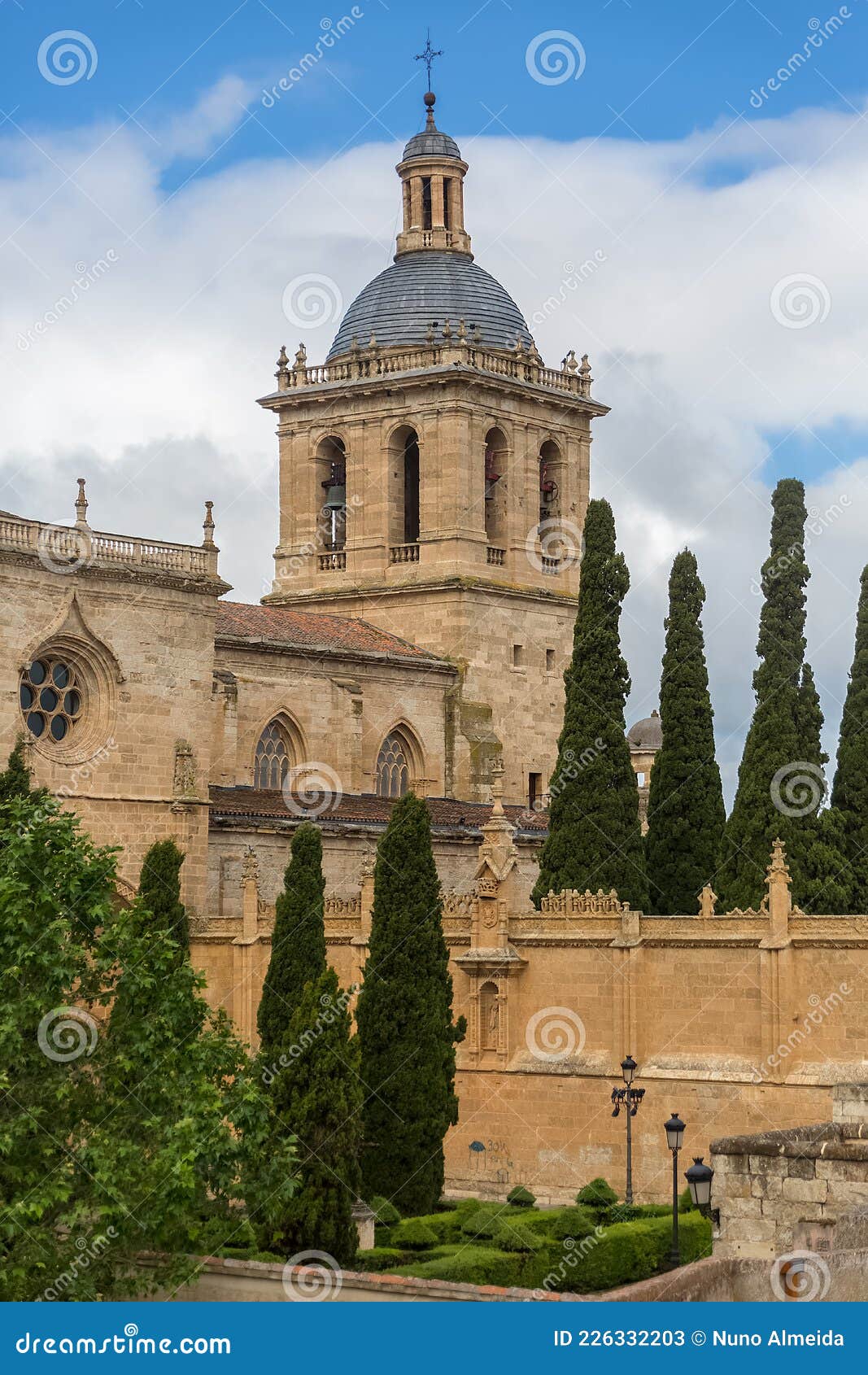 lateral view at the iconic spanish romanesque architecture building at the cuidad rodrigo cathedral, towers and domes