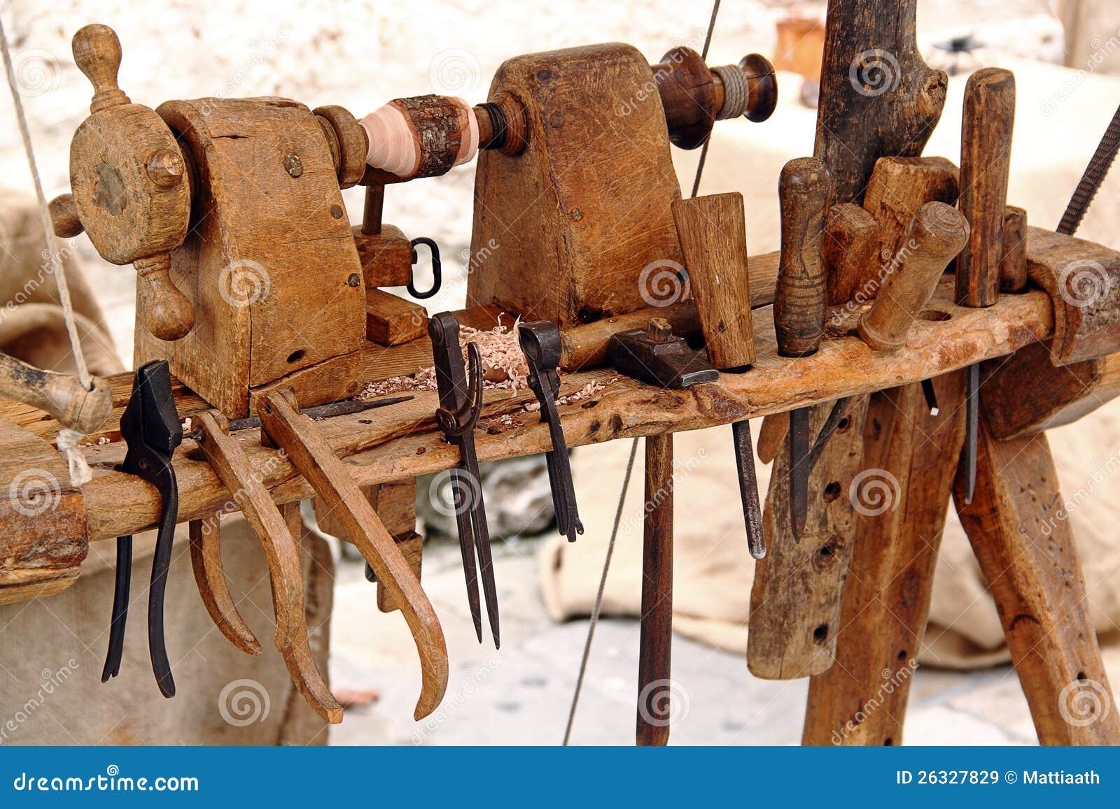  lathe with a set of tools for woodworking: hammer, chisels, pliers