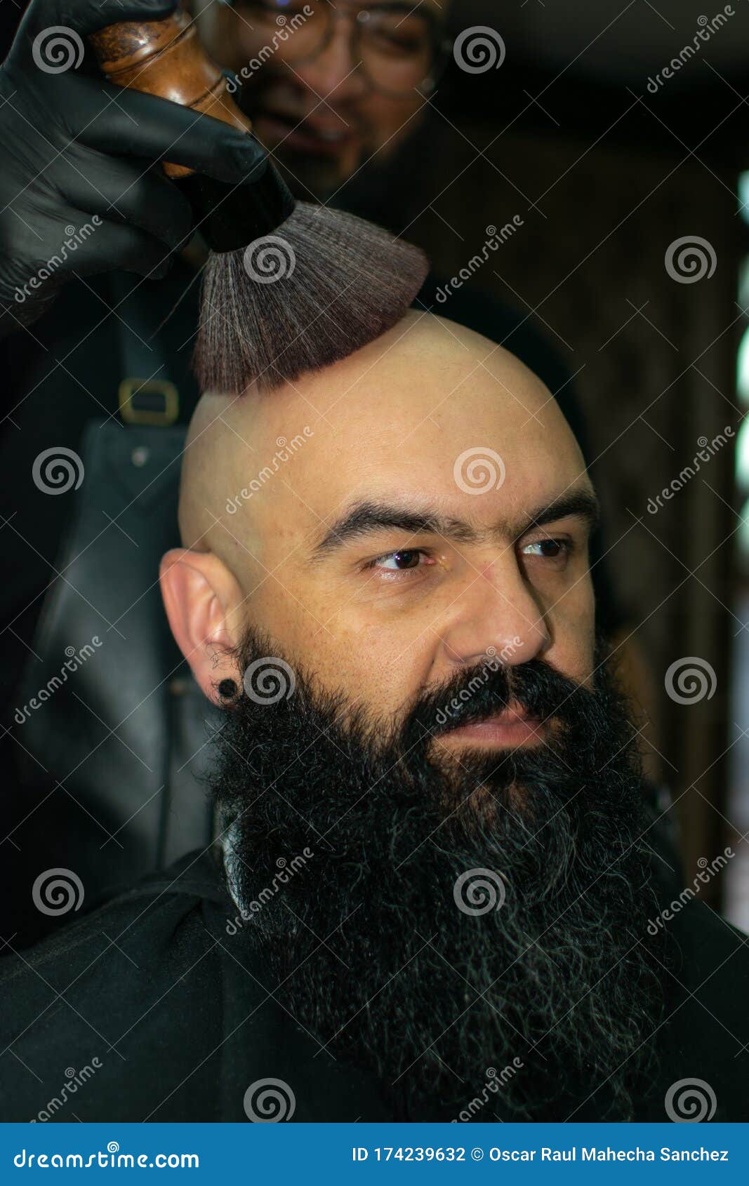 latin american barber working the style with a long beard in the city of bogot