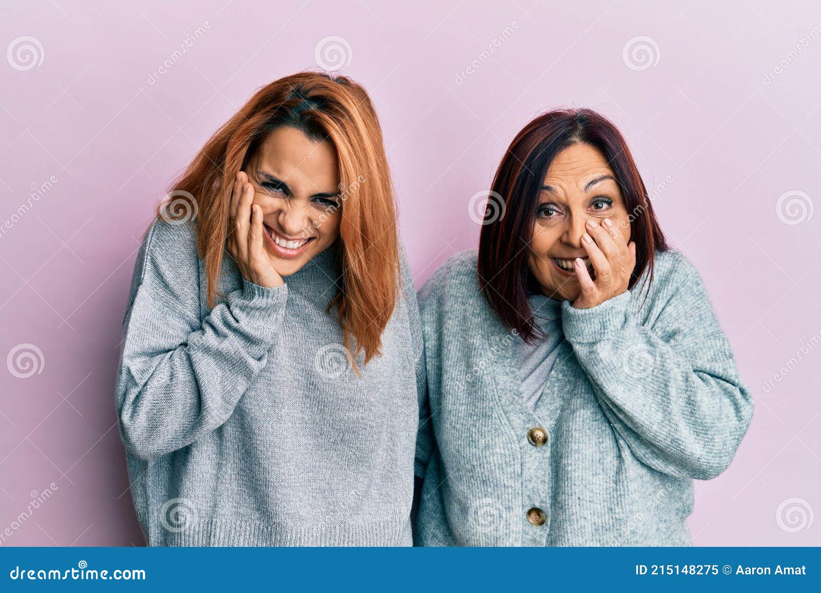 Latin Mother And Daughter Wearing Casual Clothes Laughing And