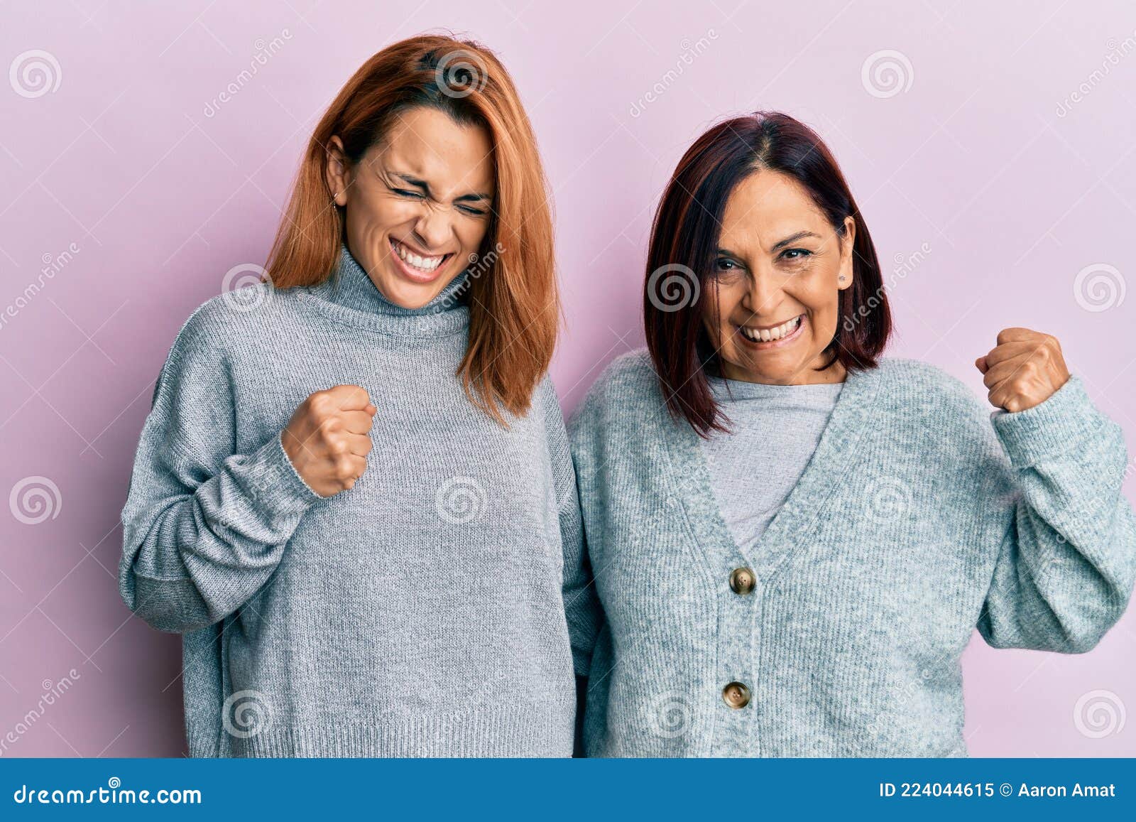 Latin Mother And Daughter Wearing Casual Clothes Very Happy And Excited Doing Winner Gesture