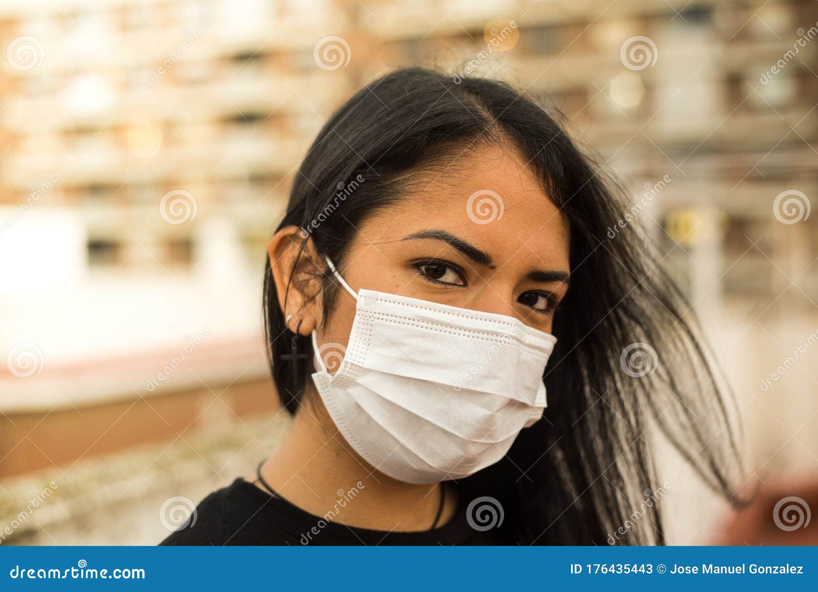 Latin Woman Looking at the Camera with a Prevention Mask and a Defiant ...