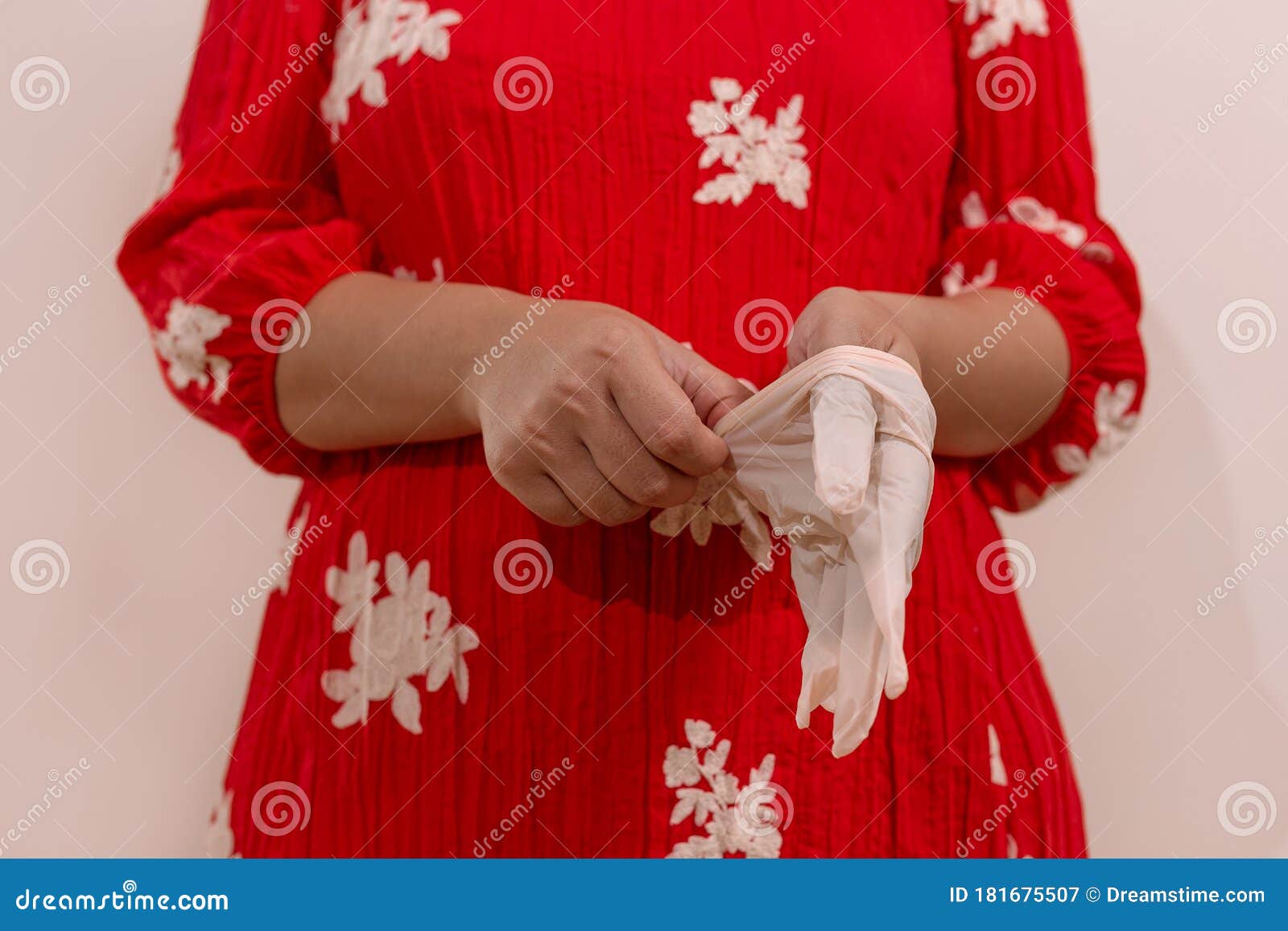 latin woman with red dress woman taking precautions by covid-19 wear a face mask, gloves and sprayer to prevent infection coronavi