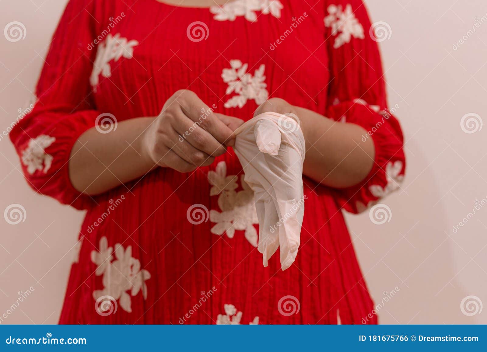 latin woman with red dress woman taking precautions by covid-19 wear a face mask, gloves and sprayer to prevent infection coronavi