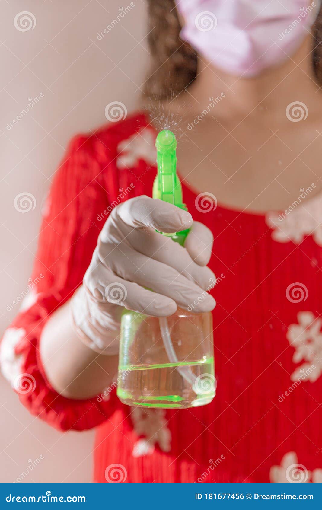 latin woman with red dress woman taking precautions by covid-19 wear a face mask, gloves and sprayer to prevent infection coronavi