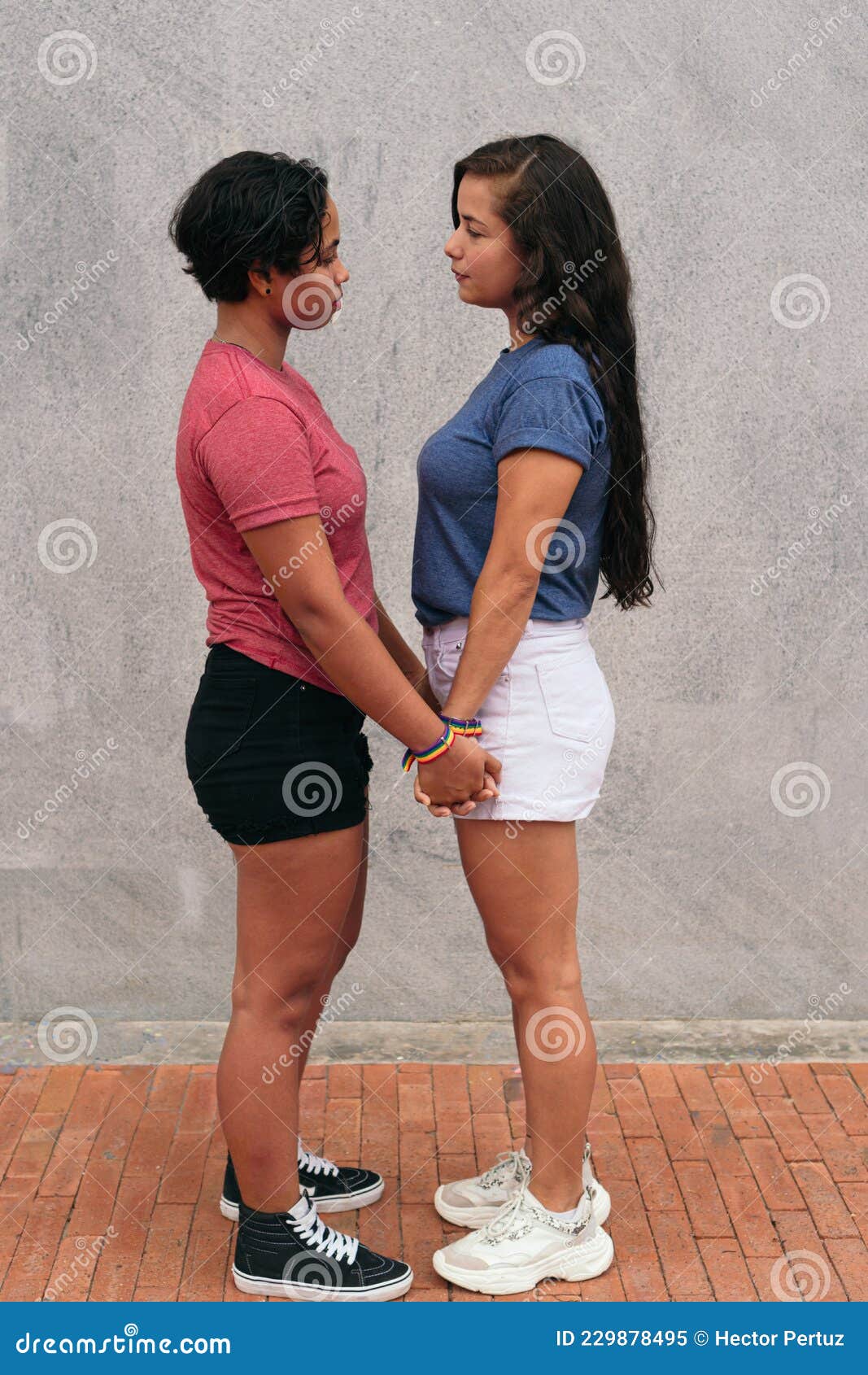 Latina Lesbian Couple Stare At Each Other During A Date In The City Stock Image Image Of