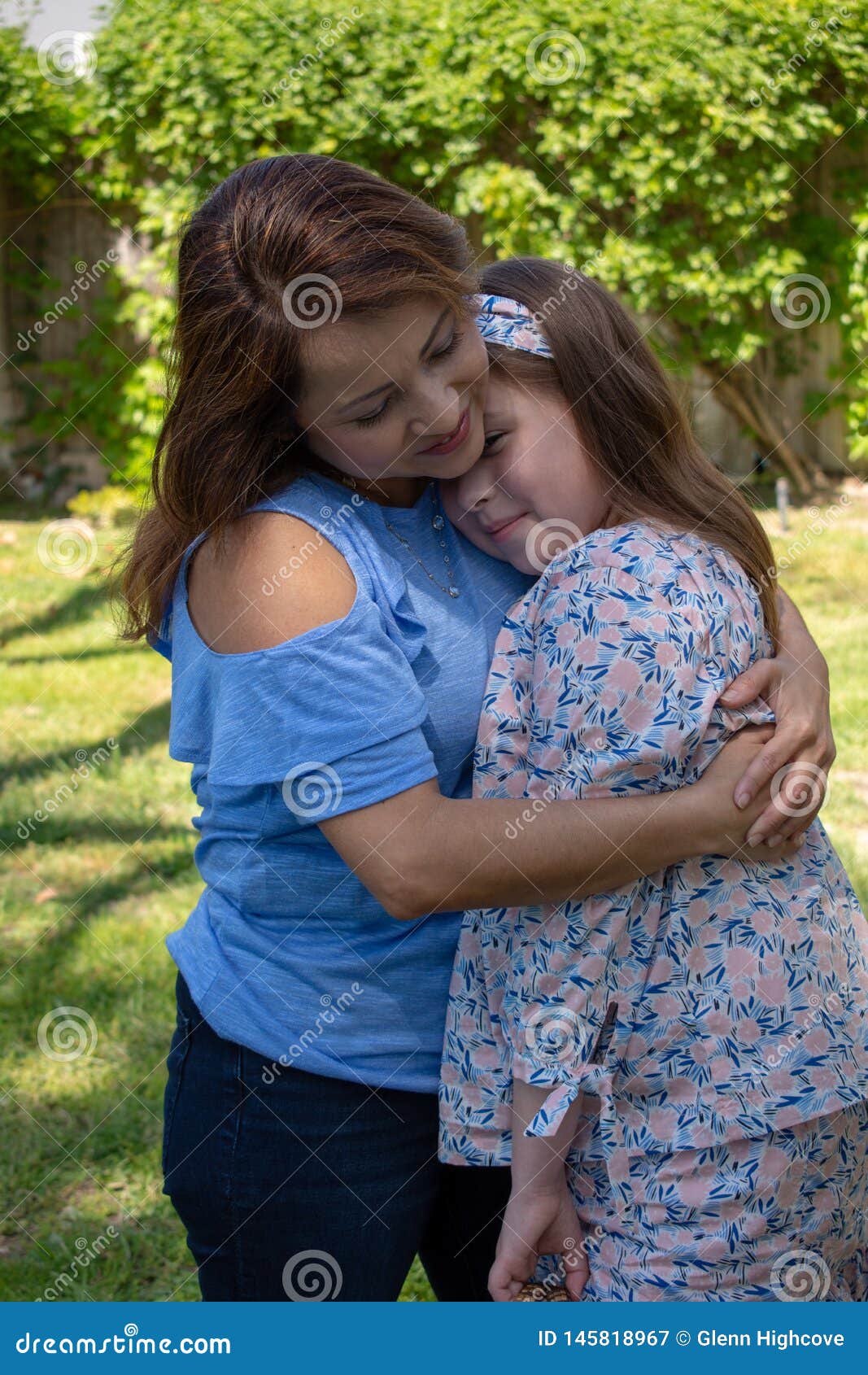 Latina Mother And Daughter Smiling And Laughing Outside In Back Yard Stock Image Image Of 