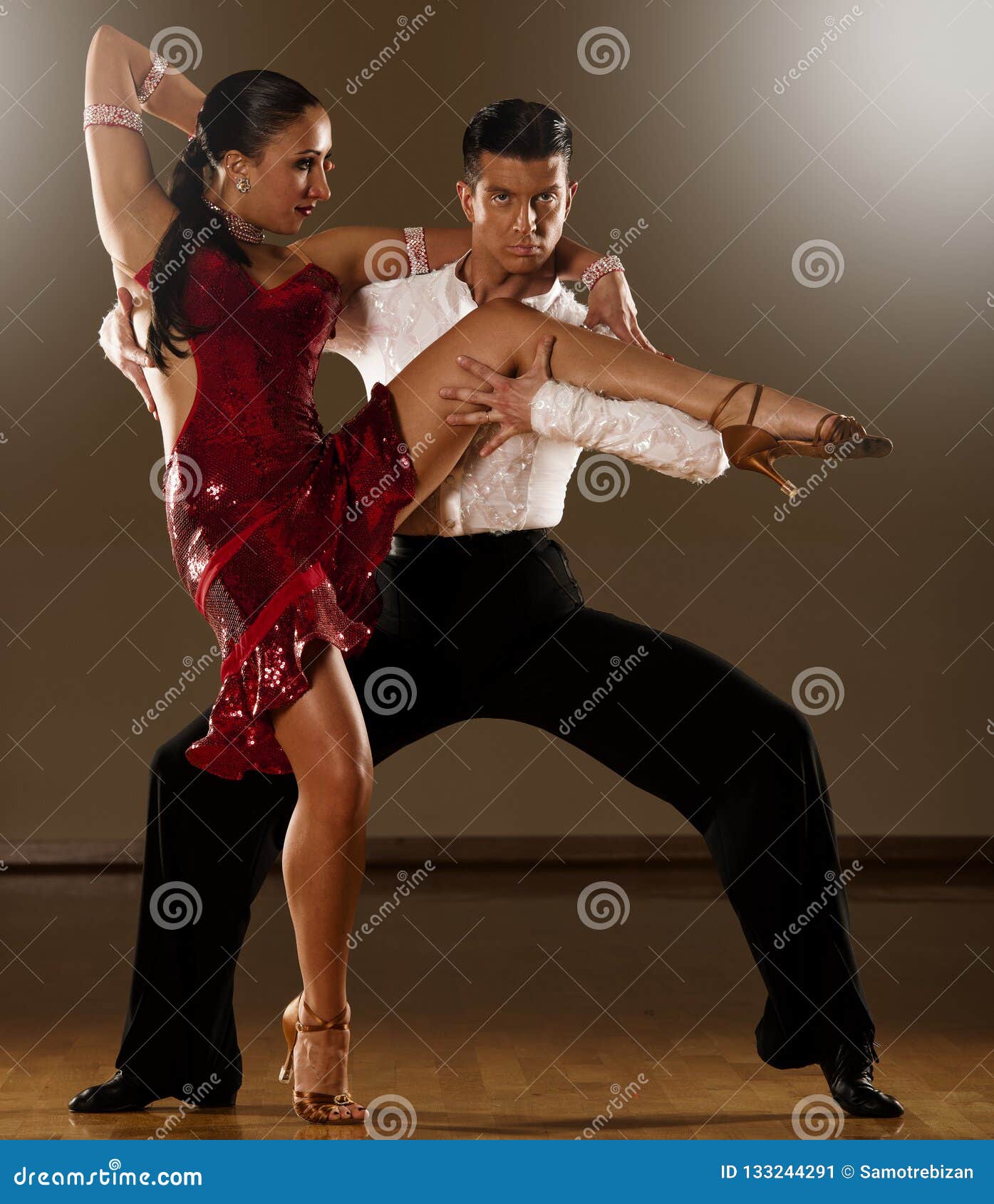 Latino Dance Couple in Action - Dancing Wild Samba Stock Image - Image