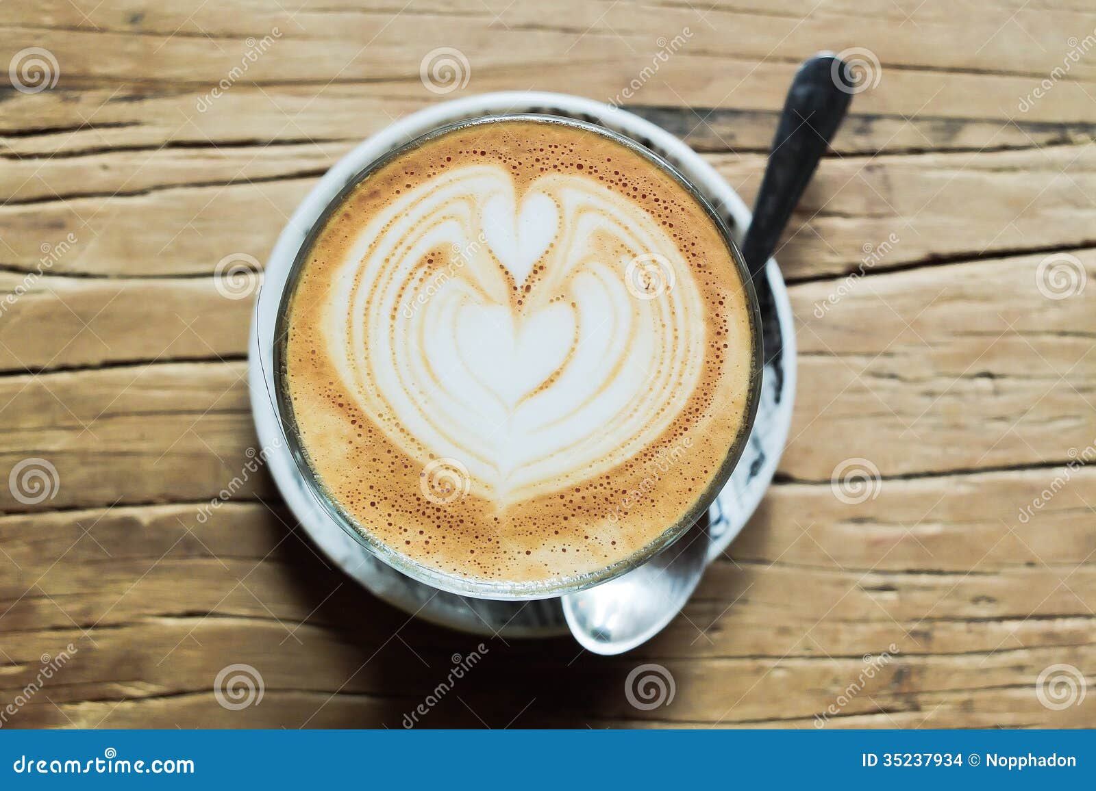Latte art on wooden table stock photo. Image of beauty - 35237934