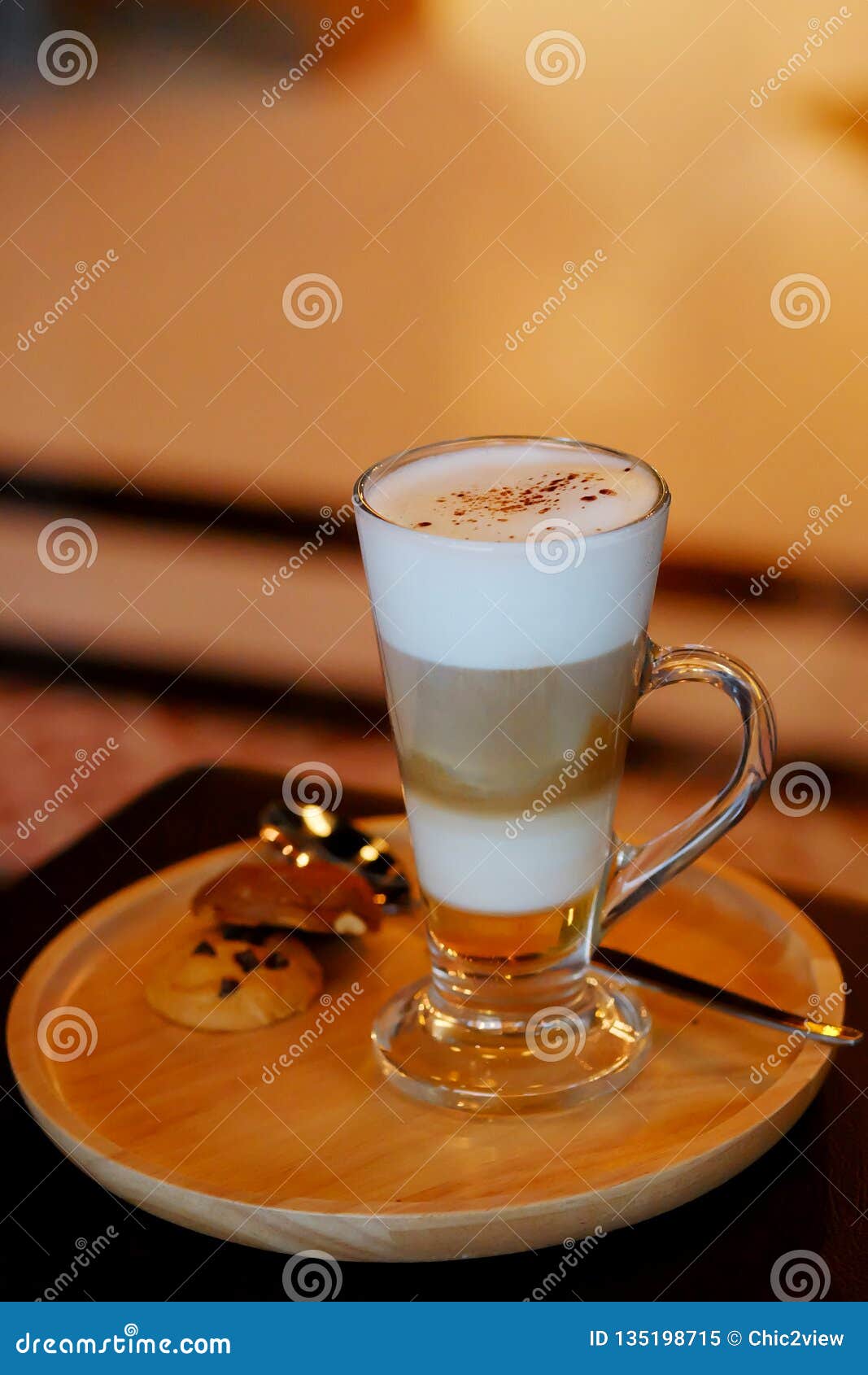 Latte Macchiato Coffee Served with Cookie in Brown Earth Tone Color
