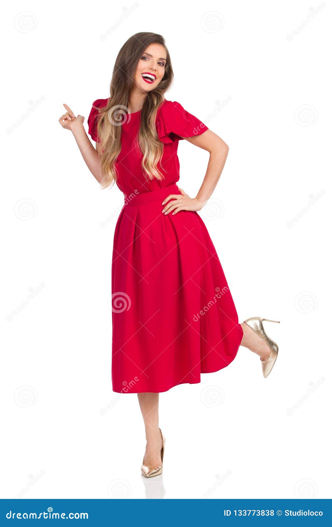 Laughing Beautiful Young Woman in Red Dress and High Heels is Standing ...