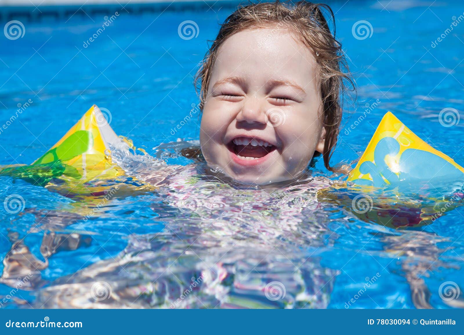 Laughing Child with Sleeves in Pool Stock Photo - Image of child ...