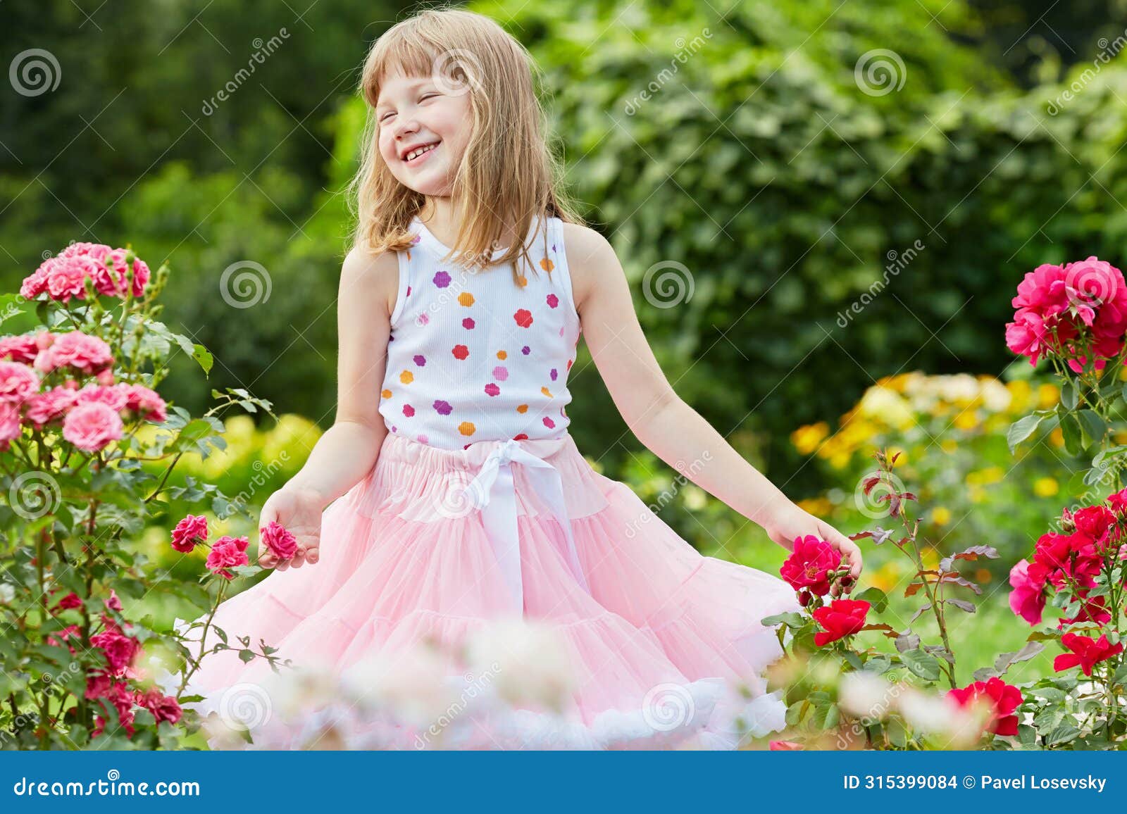 laughing little girl dressed in suit with puffy