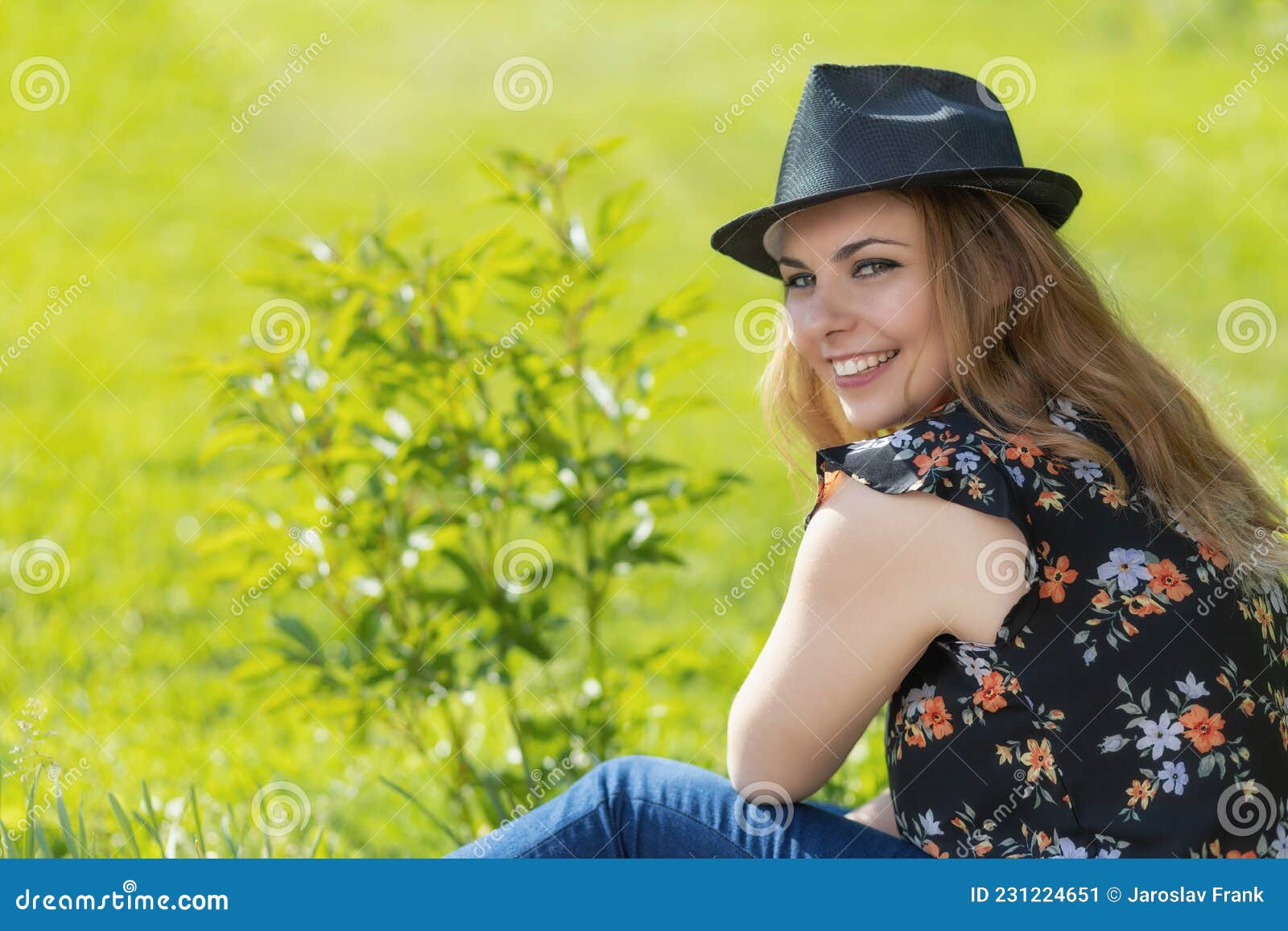 Laughing Young Girl is Looking Over Her Shoulder at the Camera Stock ...