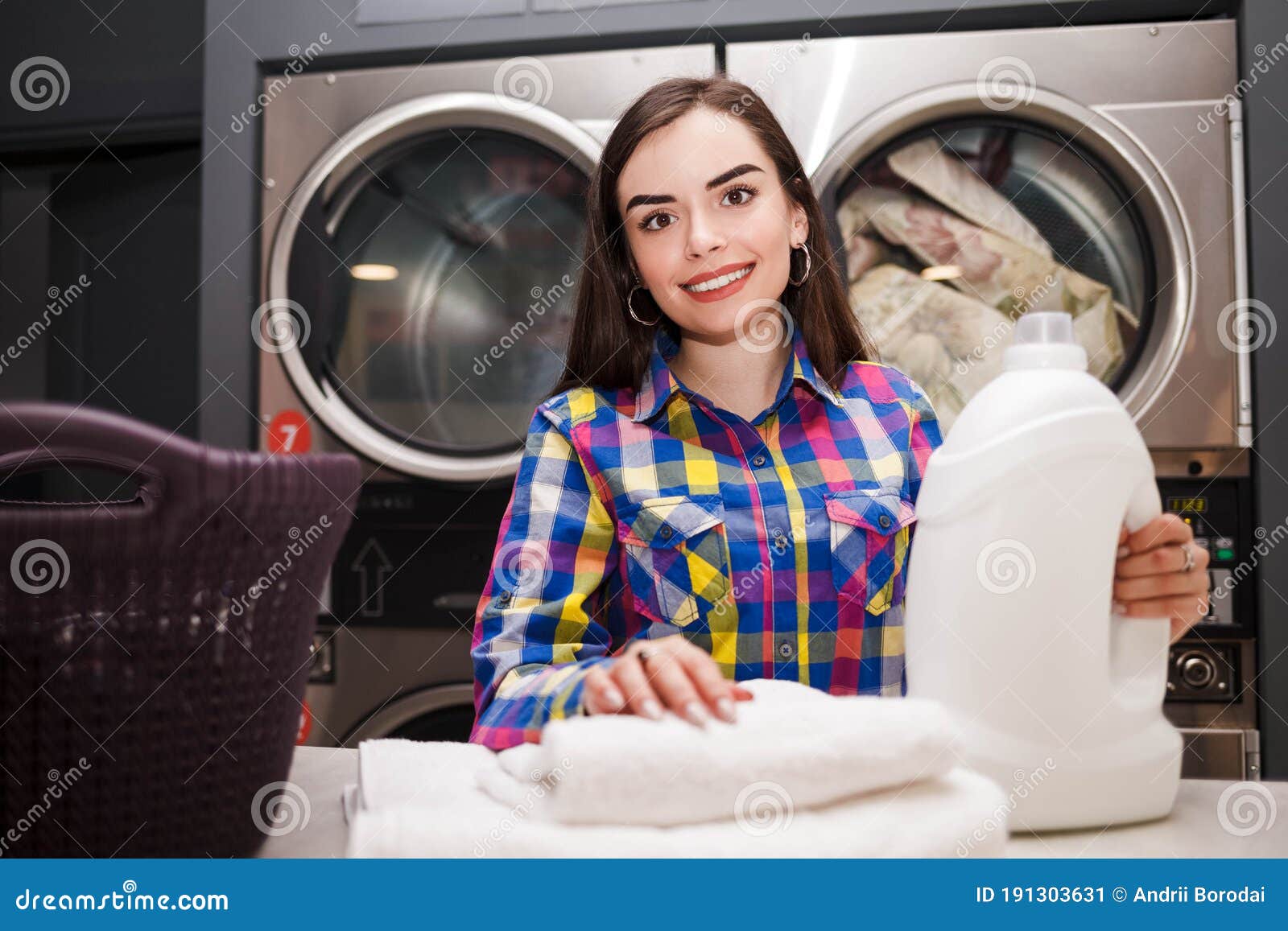 Woman with Detergent Bottle in Laundromat. Quality Laundry Detergent ...