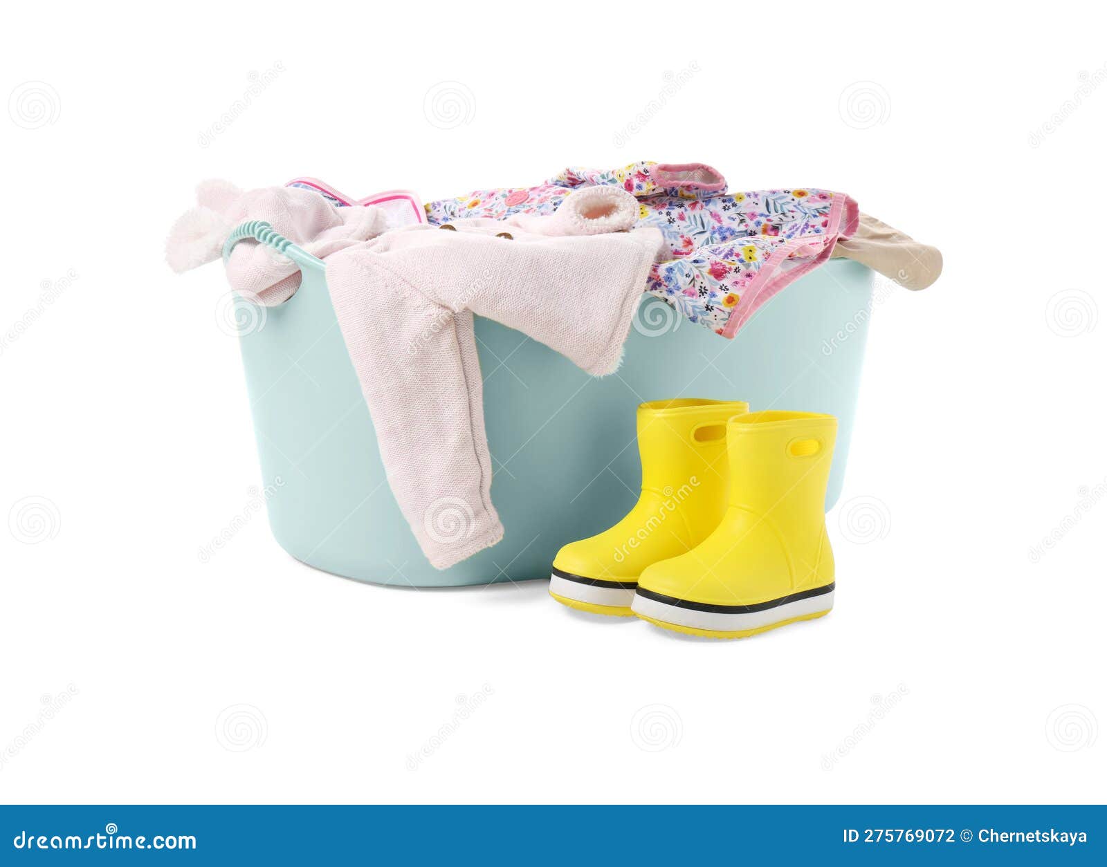 Laundry Basket with Baby Clothes and Rubber Boots Isolated on White